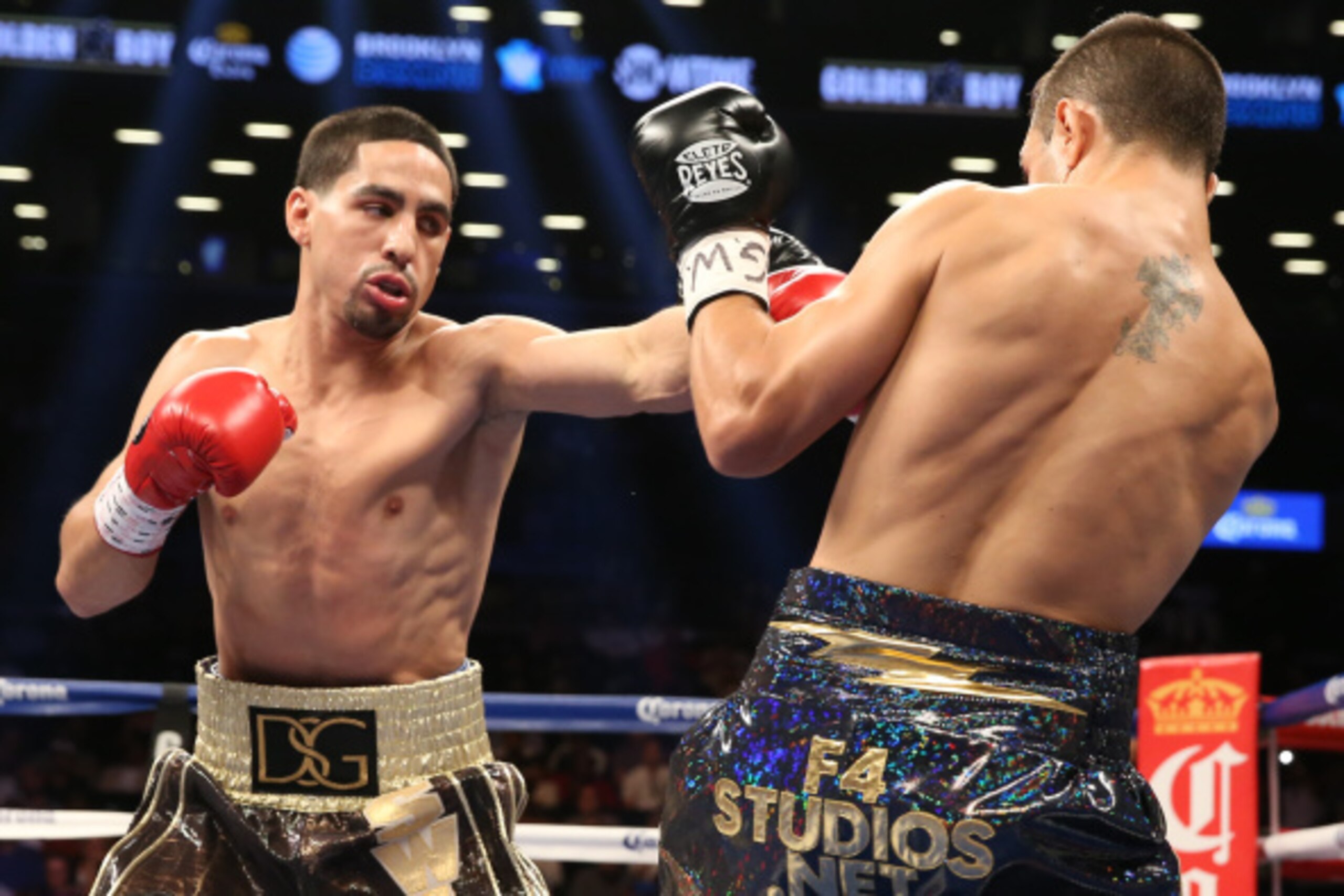 BROOKLYN, NY - AUGUST 9: Danny Garcia (Brown/Gold trunks) and Rod Salka (Black/Gold trunks) during their fight at the Barclays Center on August 9, 2014 in Brooklyn, New York. (Photo by Ed Mulholland/Getty Images)