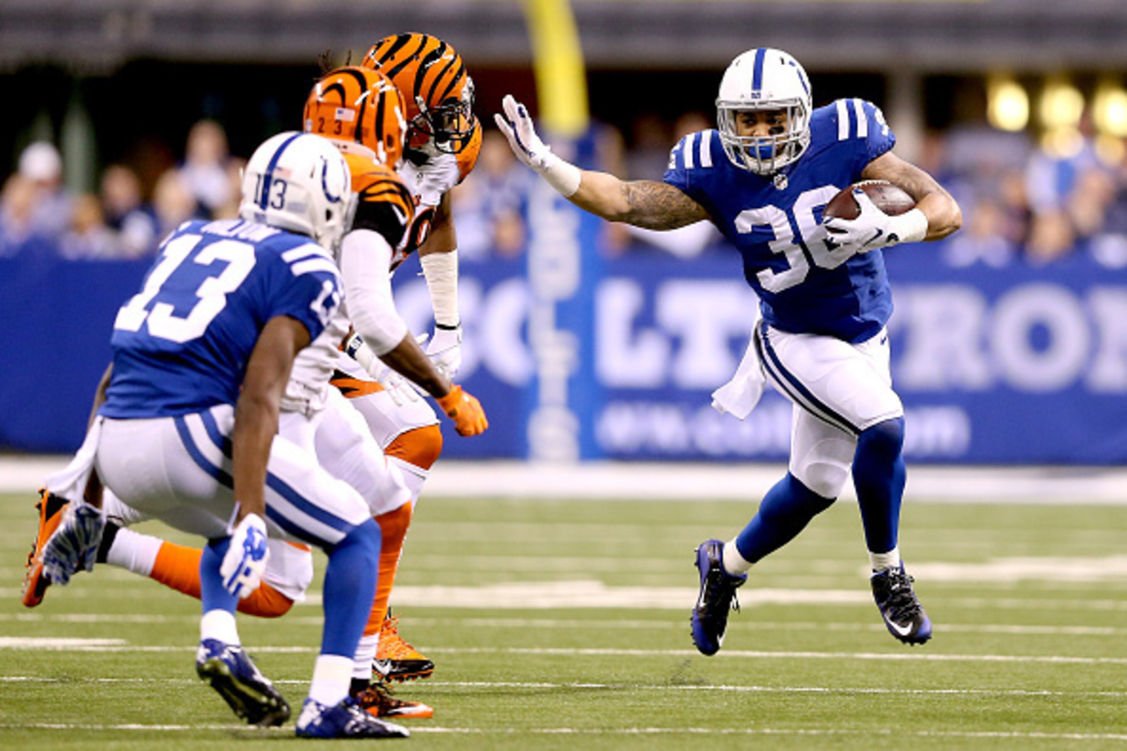 INDIANAPOLIS, IN - JANUARY 04:  Daniel Herron #36 of the Indianapolis Colts carries the ball in the first half against the Cincinnati Bengals during their AFC Wild Card game at Lucas Oil Stadium on January 4, 2015 in Indianapolis, Indiana.  (Photo by Andy