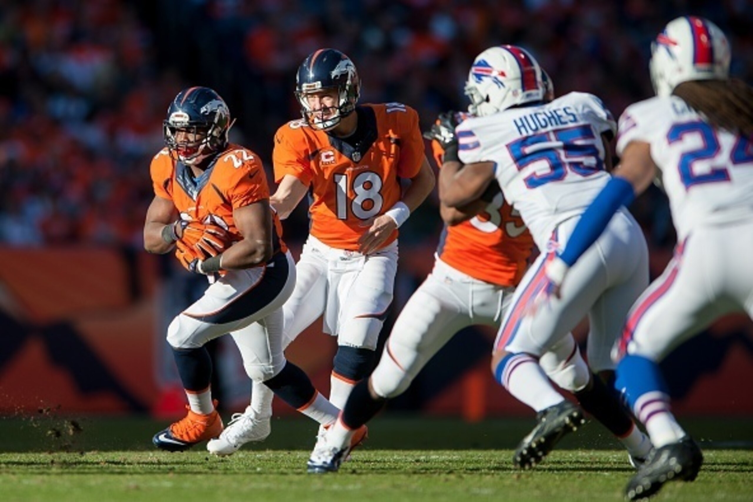 DENVER, CO - DECEMBER 7:  Running back C.J. Anderson #22 of the Denver Broncos rushes against the Buffalo Bills during a game at Sports Authority Field at Mile High on December 7, 2014 in Denver, Colorado.  (Photo by Dustin Bradford/Getty Images)