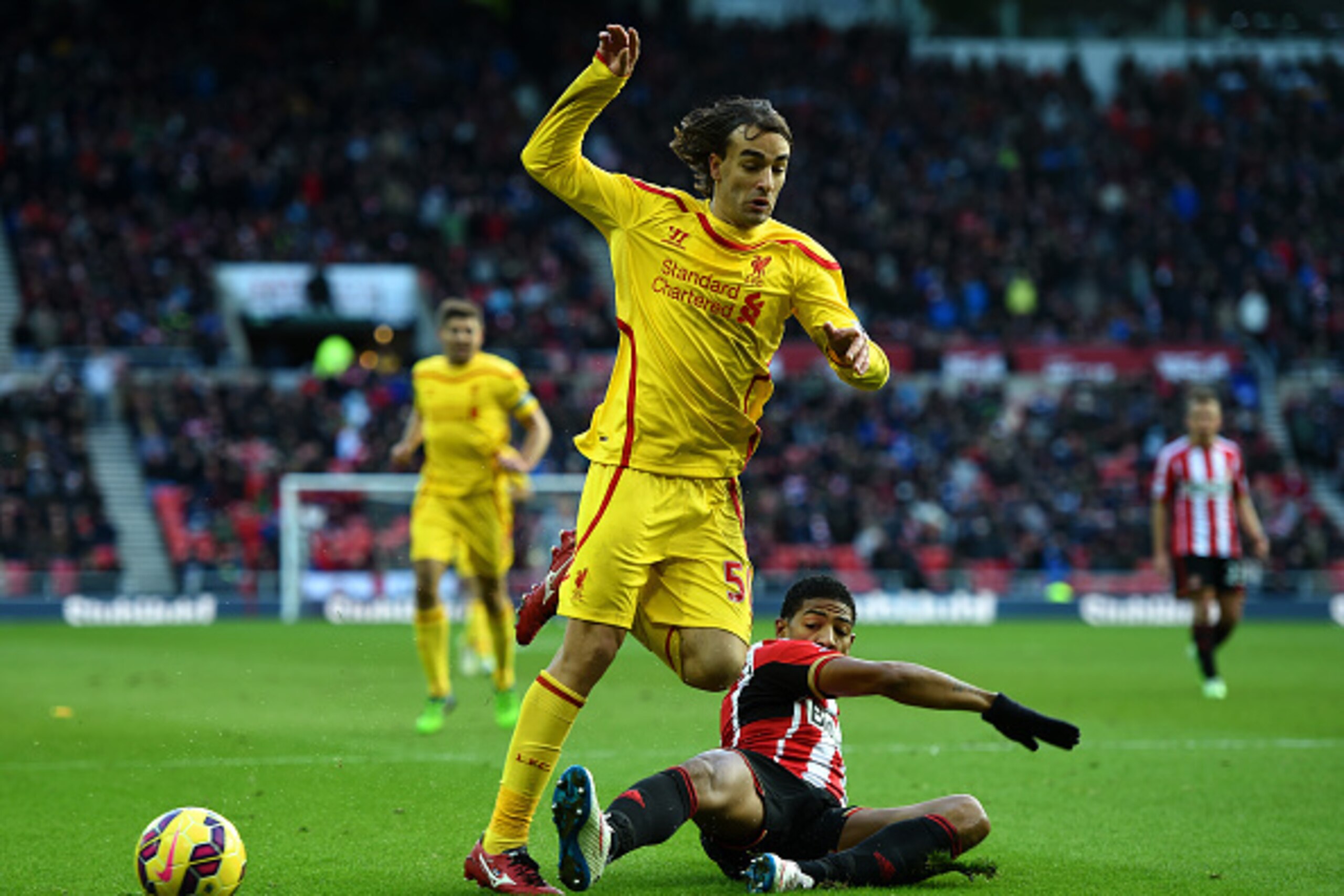 SUNDERLAND, ENGLAND - JANUARY 10:  Lazar Markovic of Liverpool battles for the ball with Patrick van Aanholt of Sunderland during the Barclays Premier League match between Sunderland and Liverpool at Stadium of Light on January 10, 2015 in Sunderland, Eng