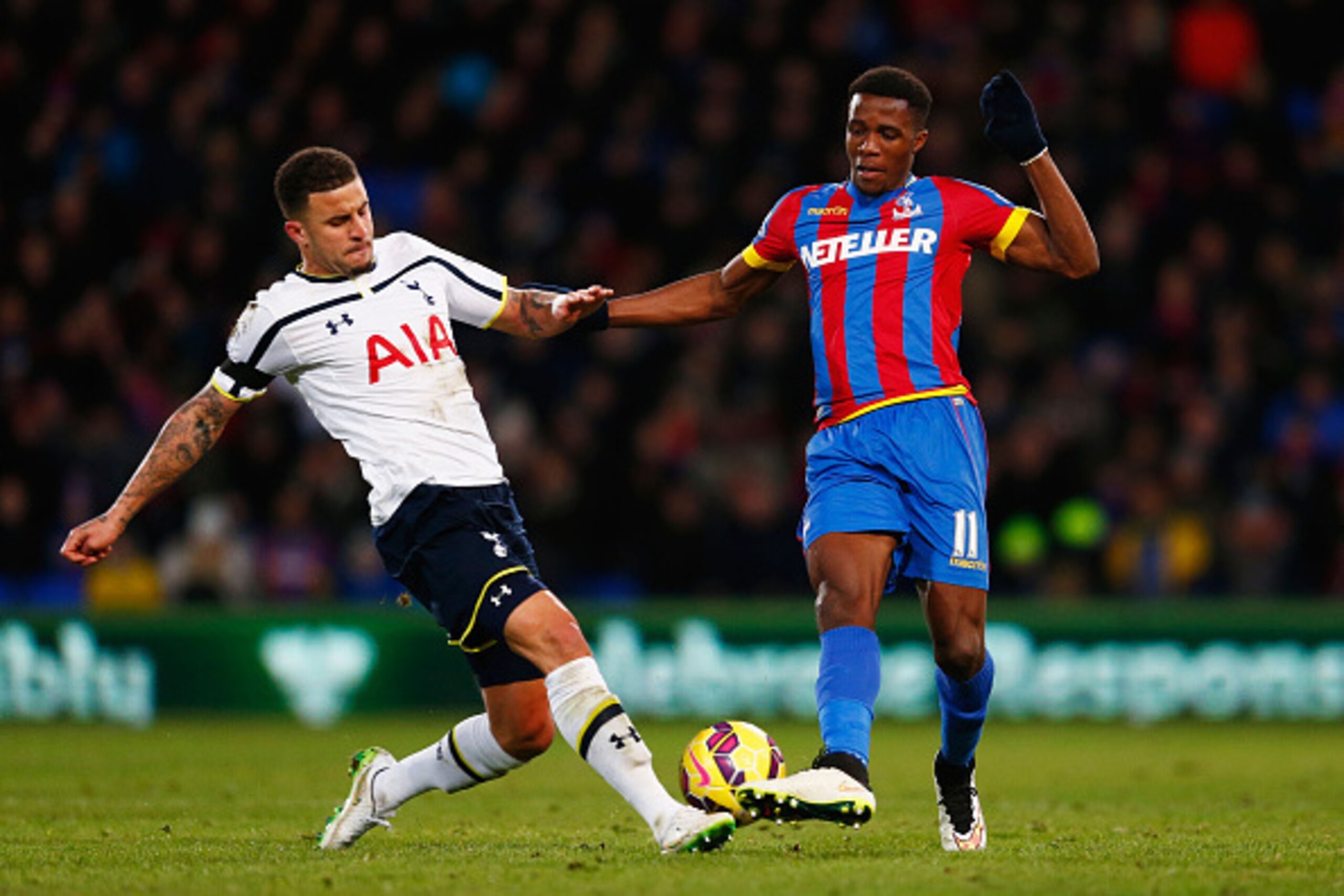 LONDON, ENGLAND - JANUARY 10:  Wilfried Zaha of Crystal Palace takes on Kyle Walker of Spurs during the Barclays Premier League match between Crystal Palace and Tottenham Hotspur at Selhurst Park on January 10, 2015 in London, England.  (Photo by Julian F