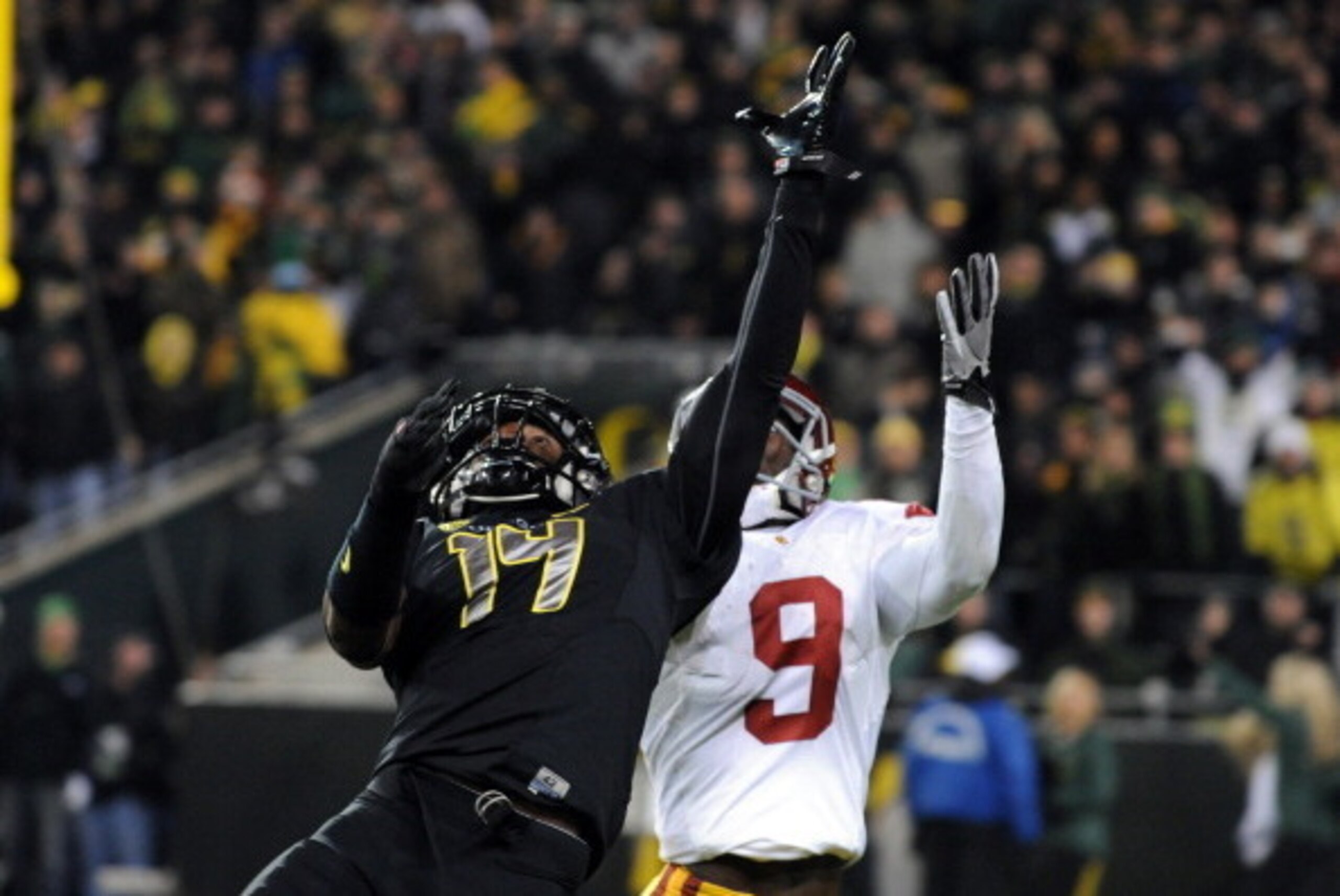 EUGENE, OR - NOVEMBER 19: Cornerback Ifo Ekpre-Olomu #14 of the Oregon Ducks goes up in a vain attempt to knock down a pass intended for wide receiver Marqise Lee #9 of the USC Trojans during the third quarter at Autzen Stadium on November 19, 2011 in Eu EUGENE, OR - NOVEMBER 19: Cornerback Ifo Ekpre-Olomu #14 of the Oregon Ducks goes up in a vain attempt to knock down a pass intended for wide receiver Marqise Lee #9 of the USC Trojans during the third quarter at Autzen Stadium on November 19, 2011 in Eu