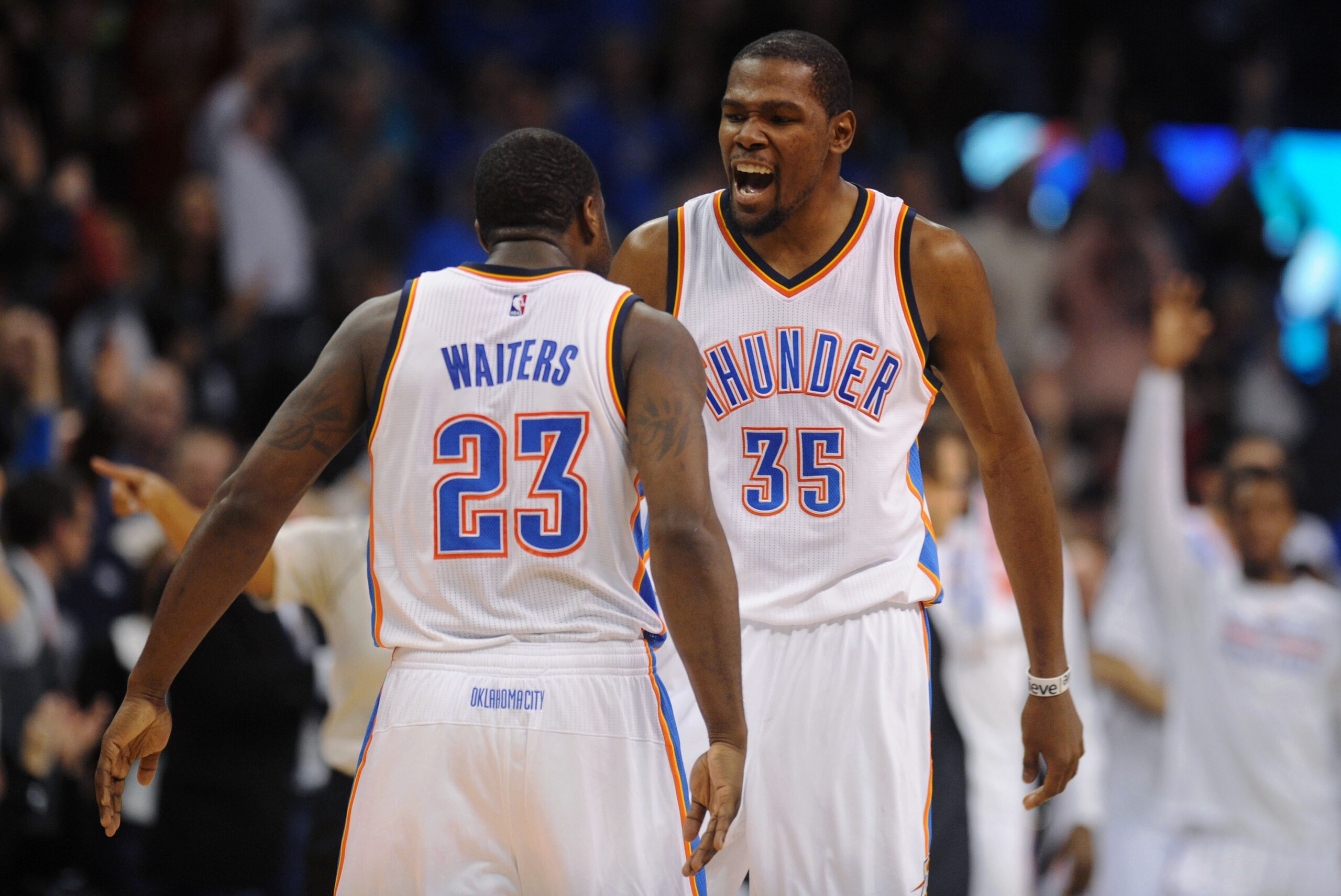 Jan 9, 2015; Oklahoma City, OK, USA;  Oklahoma City Thunder forward Kevin Durant (35) congratulates guard Dion Waiters (23) after a 3 point shot against the Utah Jazz during the fourth quarter at Chesapeake Energy Arena. Mandatory Credit: Mark D. Smith-US