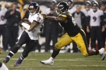 Jan 3, 2015; Pittsburgh, PA, USA; Baltimore Ravens wide receiver Steve Smith (89) carries the ball as Pittsburgh Steelers inside linebacker Vince Williams (98) chases in the third quarter during the 2014 AFC Wild Card playoff football game at Heinz Field.