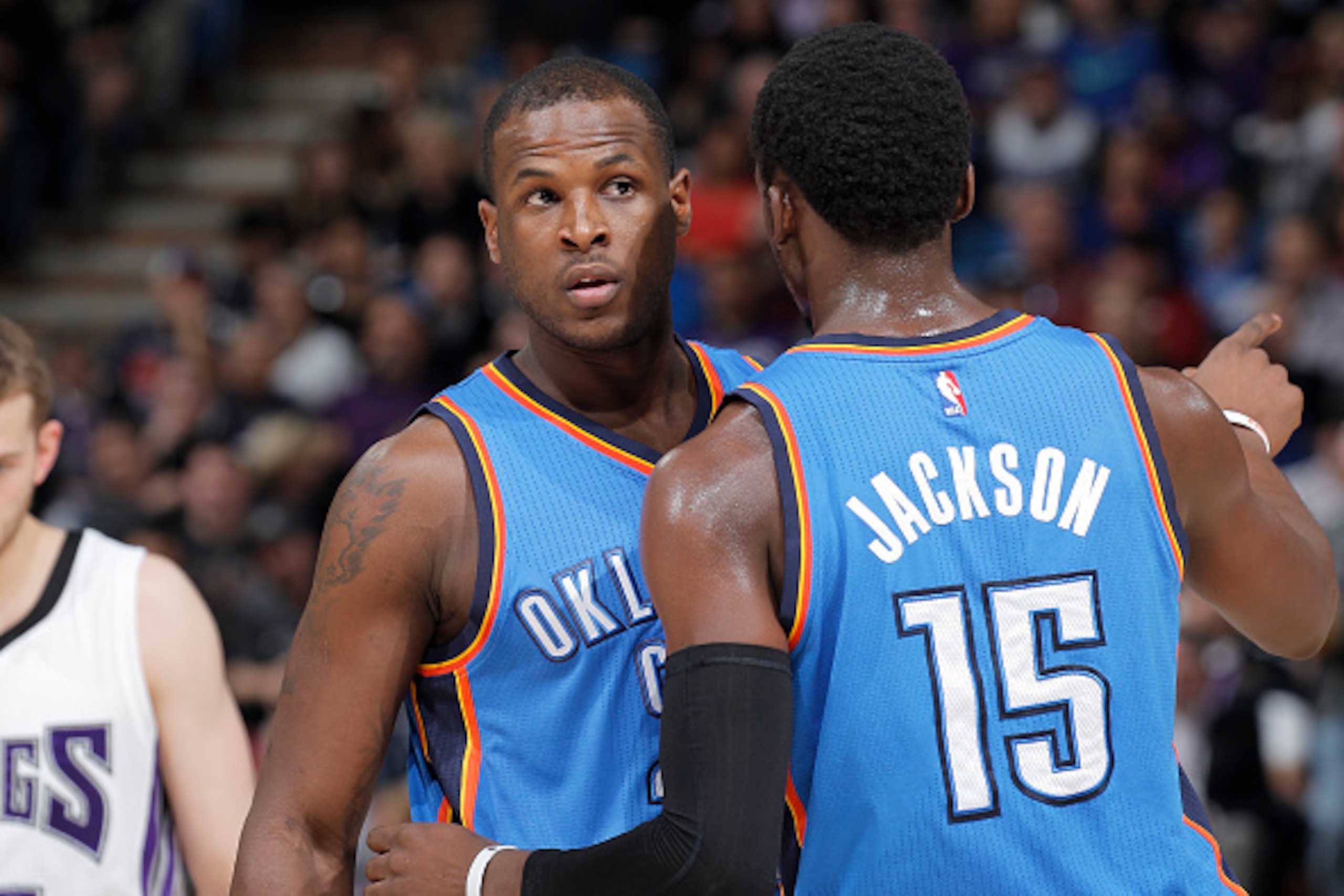 SACRAMENTO, CA - JANUARY 7: Dion Waiters #23 and Reggie Jackson #15 of the Oklahoma City Thunder talk during the game against the Sacramento Kings on January 7, 2015 at Sleep Train Arena in Sacramento, California. NOTE TO USER: User expressly acknowledges