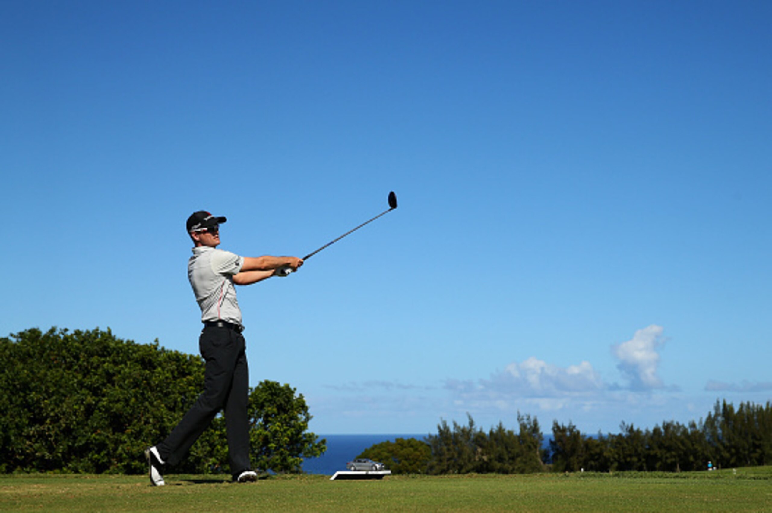 LAHAINA, HI - JANUARY 10:  Zach Johnson plays his shot from the thenth tee during round two of the Hyundai Tournament of Champions at Plantation Course at Kapalua Golf Club on January 10, 2015 in Lahaina, Hawaii.  (Photo by Mike Ehrmann/Getty Images)