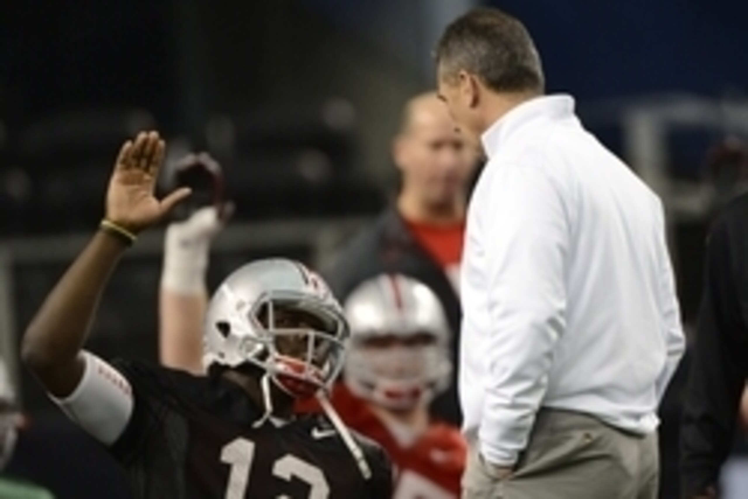 Jan 10, 2015; Arlington, TX, USA; Ohio State Buckeyes quarterback Cardale Jones (12) speaks with head coach Urban Meyer during practice in preparation for the CFP National Championship at AT&T Stadium. Mandatory Credit: Tommy Gilligan-USA TODAY Sports