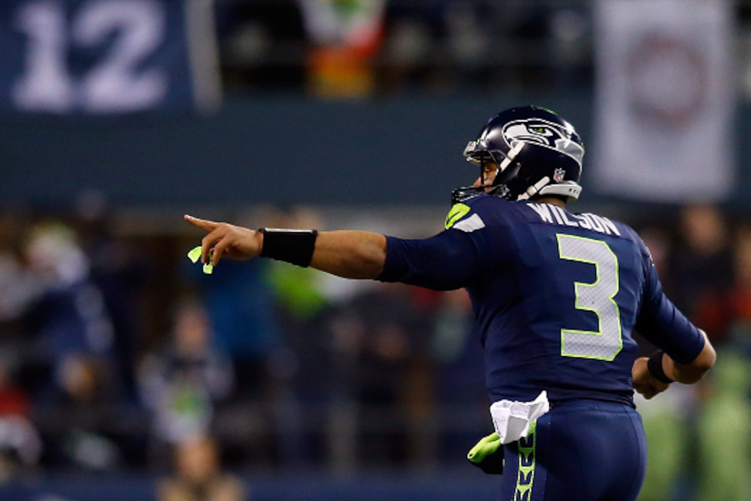SEATTLE, WA - JANUARY 10:  Russell Wilson #3 celebrates Jermaine Kearse #15 of the Seattle Seahawks 63 yard touchdown in the second quarter against the Carolina Panthers during the 2015 NFC Divisional Playoff game at CenturyLink Field on January 10, 2015 