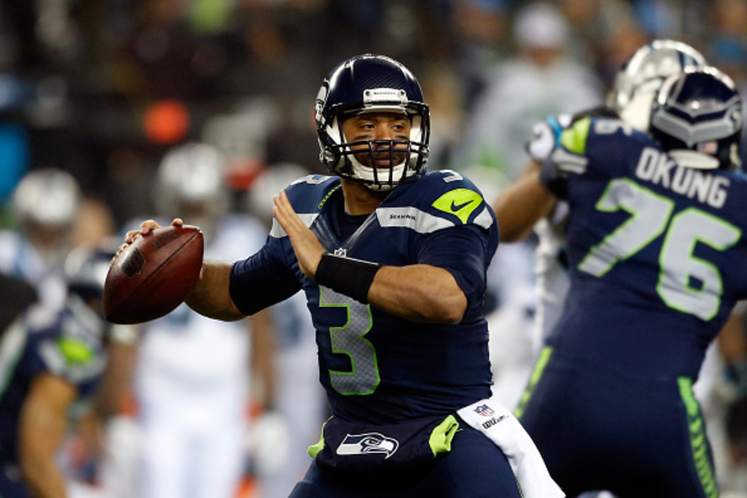 SEATTLE, WA - JANUARY 10: Russell Wilson #3 of the Seattle Seahawks throws the ball in the first half against the Carolina Panthers during the 2015 NFC Divisional Playoff game at CenturyLink Field on January 10, 2015 in Seattle, Washington. (Photo by Ot SEATTLE, WA - JANUARY 10: Russell Wilson #3 of the Seattle Seahawks throws the ball in the first half against the Carolina Panthers during the 2015 NFC Divisional Playoff game at CenturyLink Field on January 10, 2015 in Seattle, Washington. (Photo by Ot