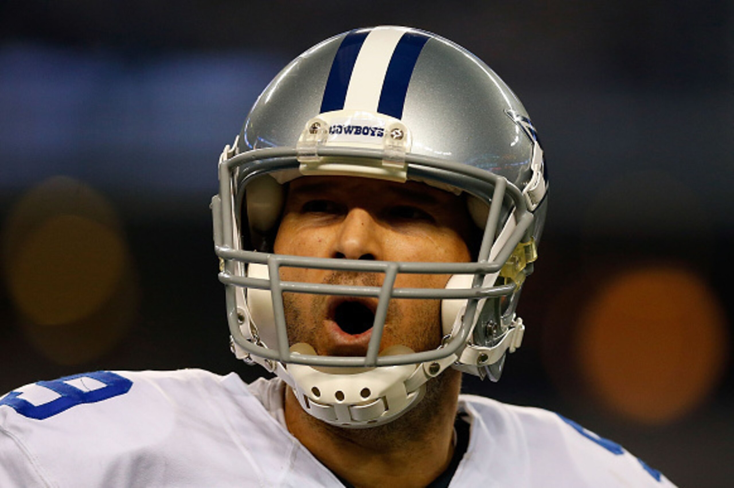ARLINGTON, TX - JANUARY 04:  Tony Romo #9 of the Dallas Cowboys reacts against the Detroit Lions during the second half of their NFC Wild Card Playoff game at AT&T Stadium on January 4, 2015 in Arlington, Texas.  (Photo by Tom Pennington/Getty Images)