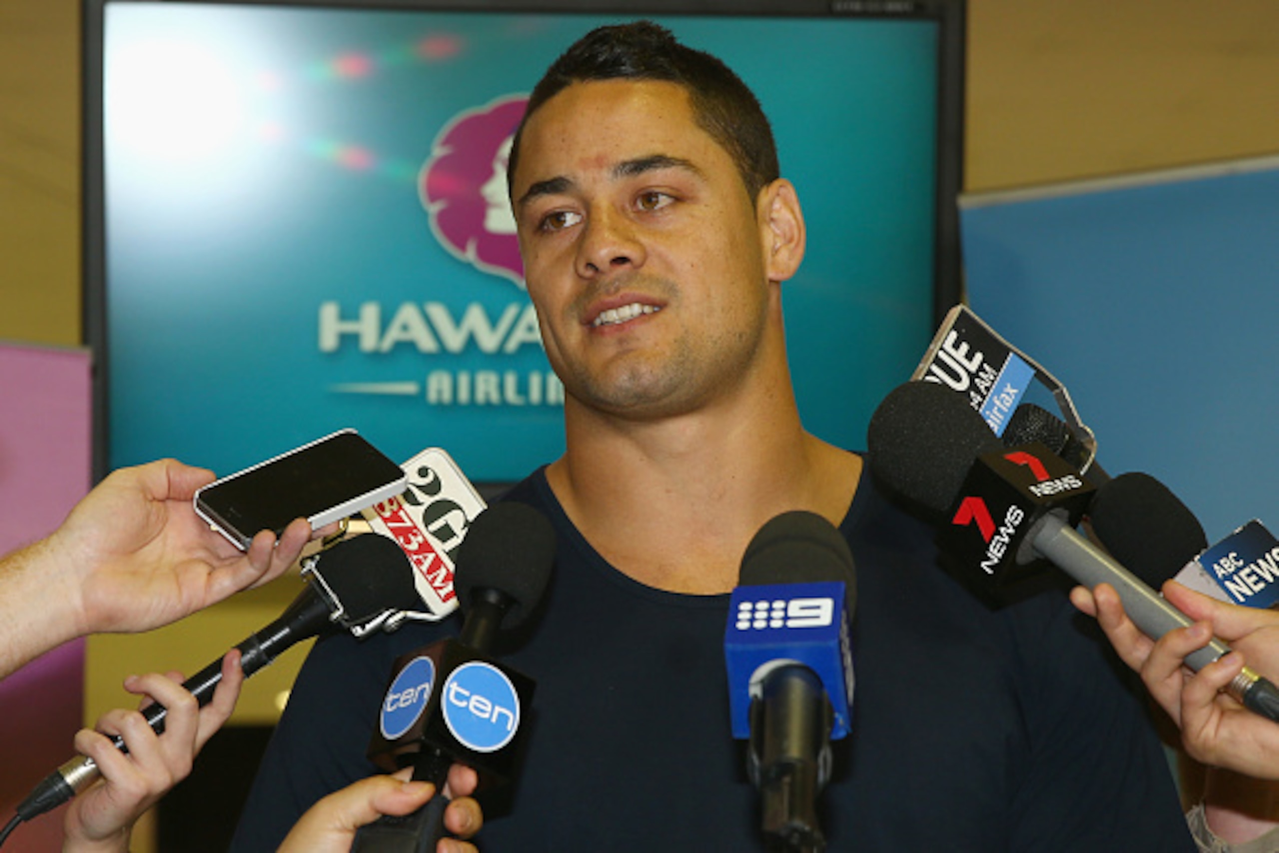 SYDNEY, AUSTRALIA - OCTOBER 19:  Former NRL Rugby League player Jarryd Hayne speaks to the media at the check-in counters at Sydney International Airport on October 19, 2014 in Sydney, Australia. Hayne announced his decision to leave the Parramatta Eels o