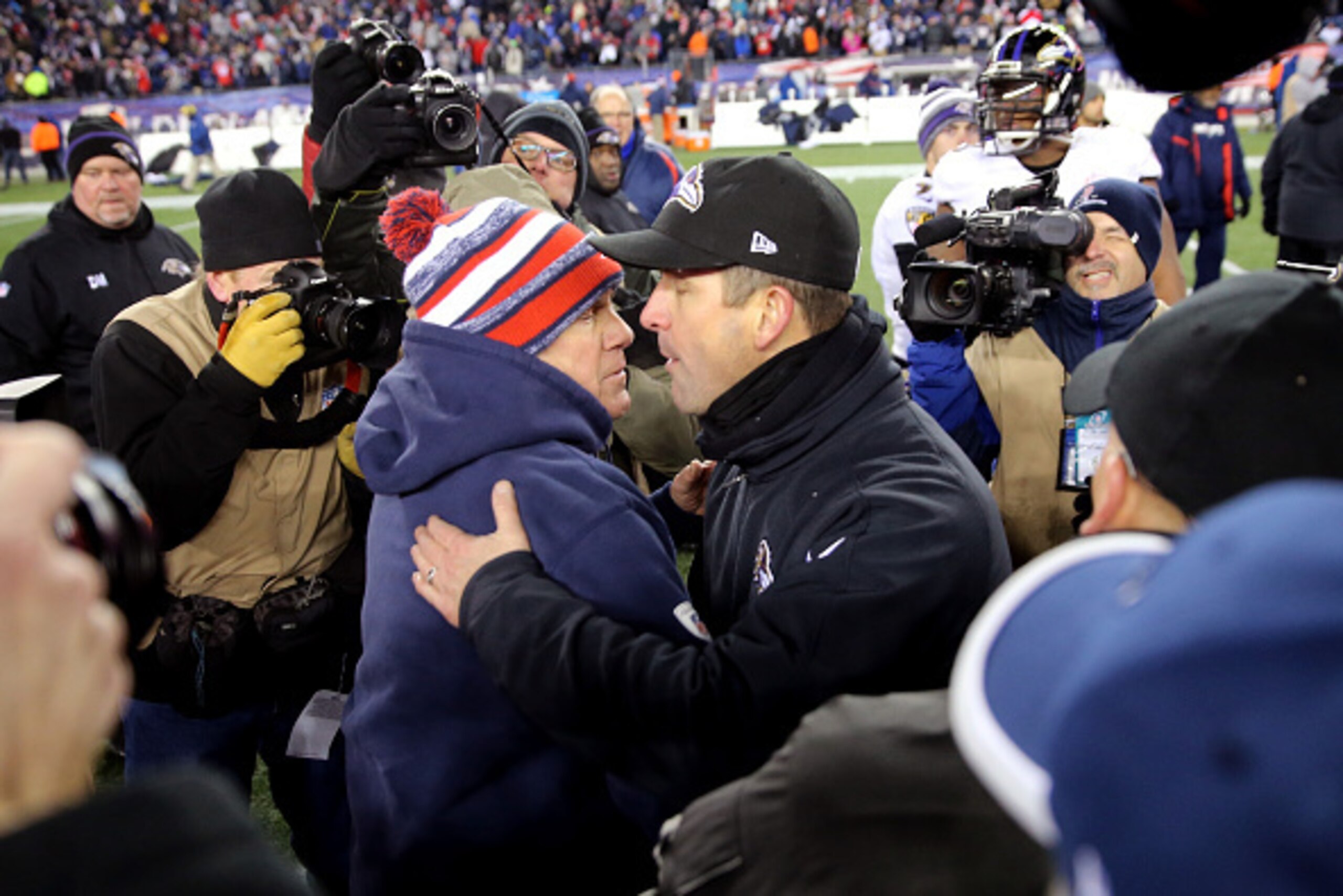 FOXBORO, MA - JANUARY 10:  Head coaces Bill Belichick of the New England Patriots and John Harbaugh of the Baltimore Ravens shake hands following the 2015 AFC Divisional Playoffs game at Gillette Stadium on January 10, 2015 in Foxboro, Massachusetts.  (Ph