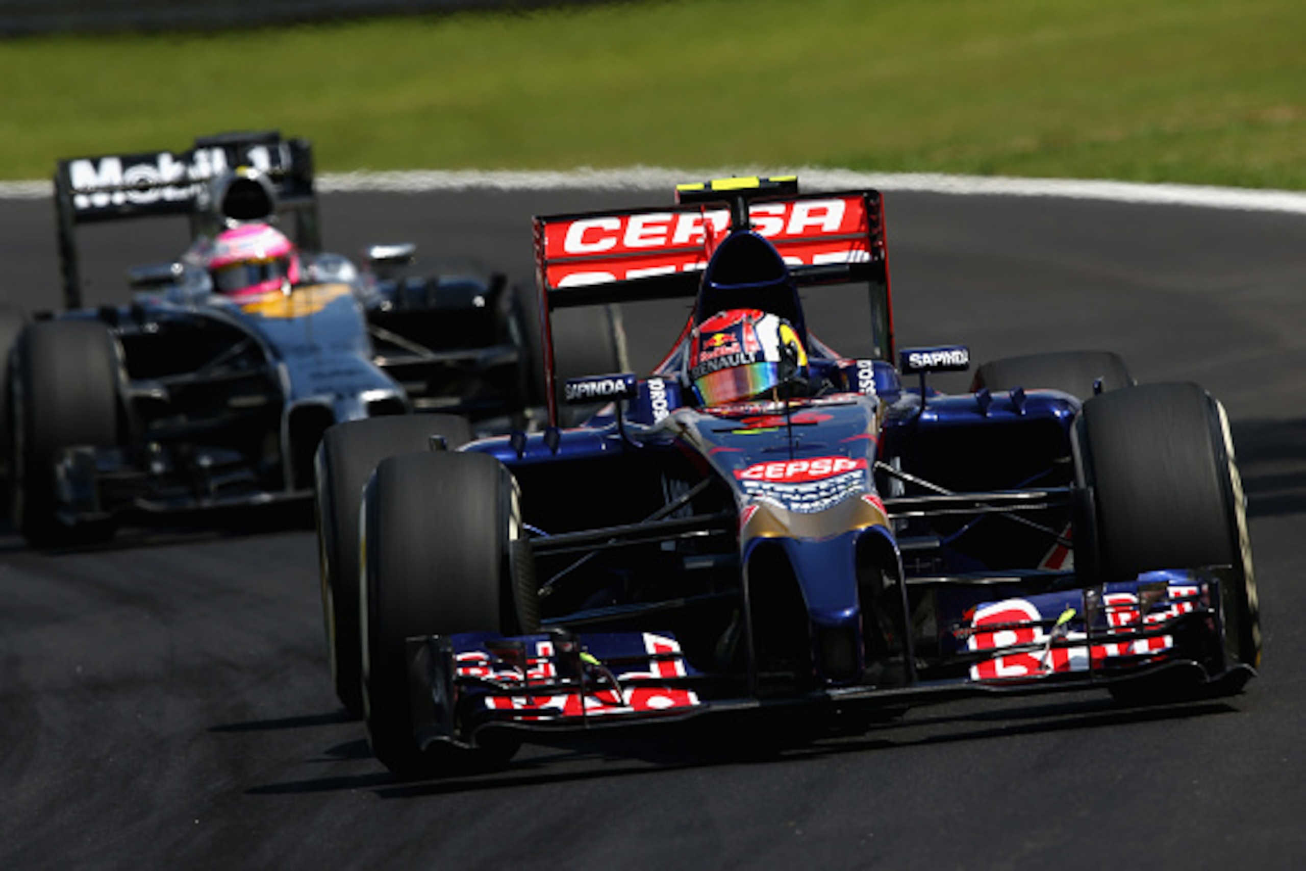 SAO PAULO, BRAZIL - NOVEMBER 09:  Daniil Kvyat of Russia and Scuderia Toro Rosso drives during the Brazilian Formula One Grand Prix at Autodromo Jose Carlos Pace on November 9, 2014 in Sao Paulo, Brazil.  (Photo by Clive Mason/Getty Images)