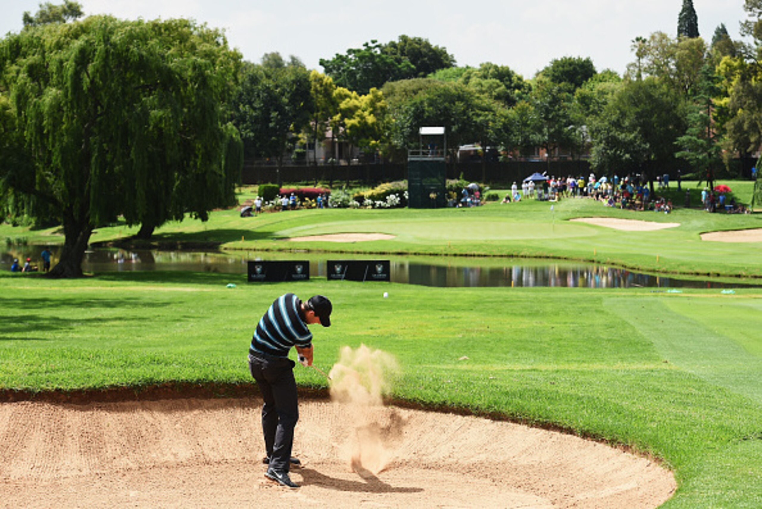 JOHANNESBURG, SOUTH AFRICA - JANUARY 10:  Charl Schwartzel of South Africa plays a bunker shot on the 10th hole during the third round of the South African Open at Glendower Golf Club on January 10, 2015 in Johannesburg, South Africa.  (Photo by Stuart Fr