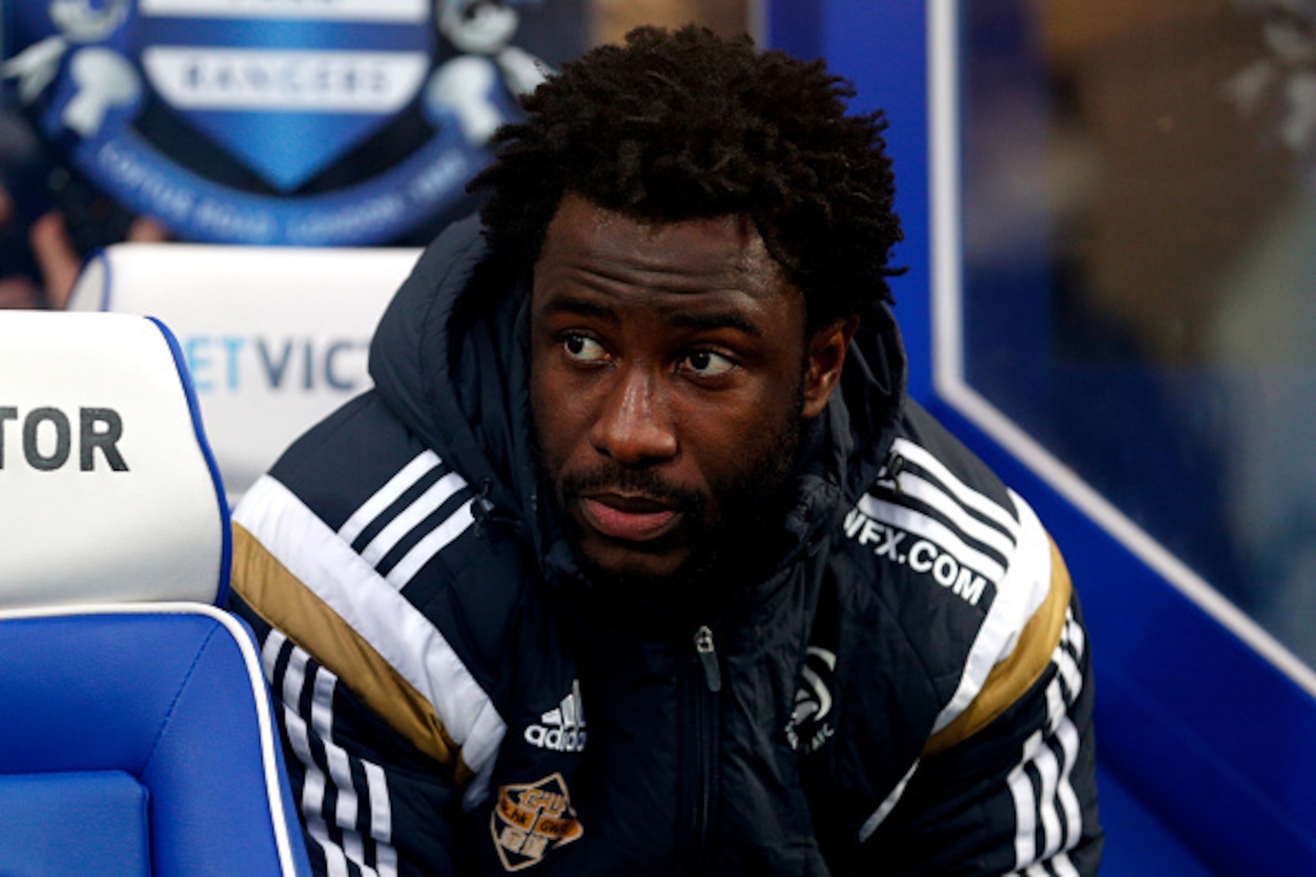 LONDON, ENGLAND - JANUARY 01:  Substitute Wilfried Bony of Swansea City looks on during the Barclays Premier League match between Queens Park Rangers and Swansea City at Loftus Road on January 1, 2015 in London, England.  (Photo by Harry Engels/Getty Imag