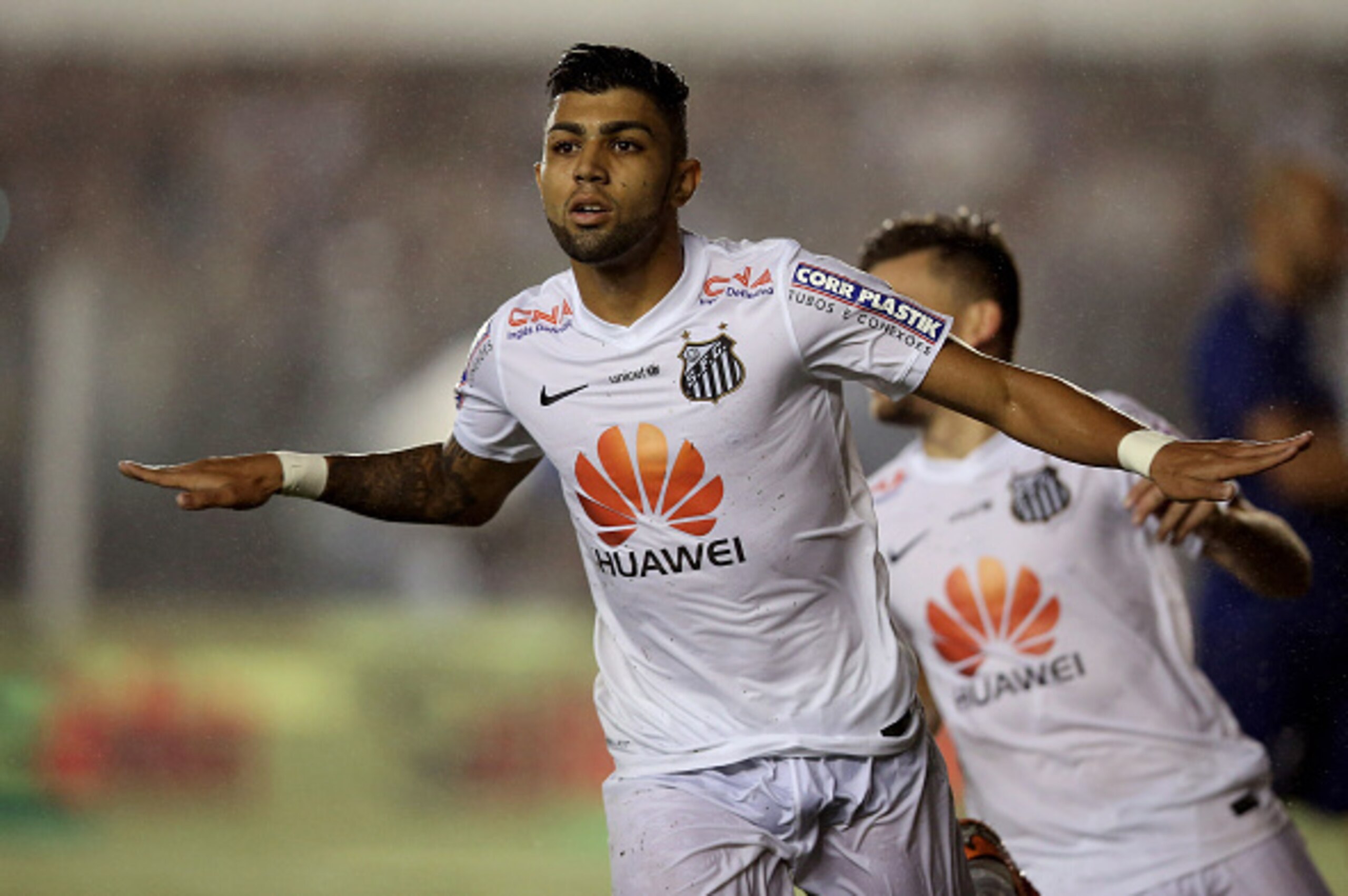 SANTOS, BRAZIL - NOVEMBER 05:  Gabriel of Santos celebrates scoring the second goal during the match between Santos and Cruzeiro for Copa do Brasil 2014 at Vila Belmiro Stadium on November 5, 2014 in Santos, Brazil.  (Photo by Friedemann Vogel/Getty Image