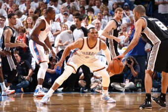 OKLAHOMA CITY, OK - May 31: Russell Westbrook #0 of the Oklahoma City Thunder plays tight defense against the San Antonio Spurs in Game 6 of the Western Conference Finals during the 2014 NBA Playoffs at the Chesapeake Arena on May 31, 2014 in Oklahoma Cit