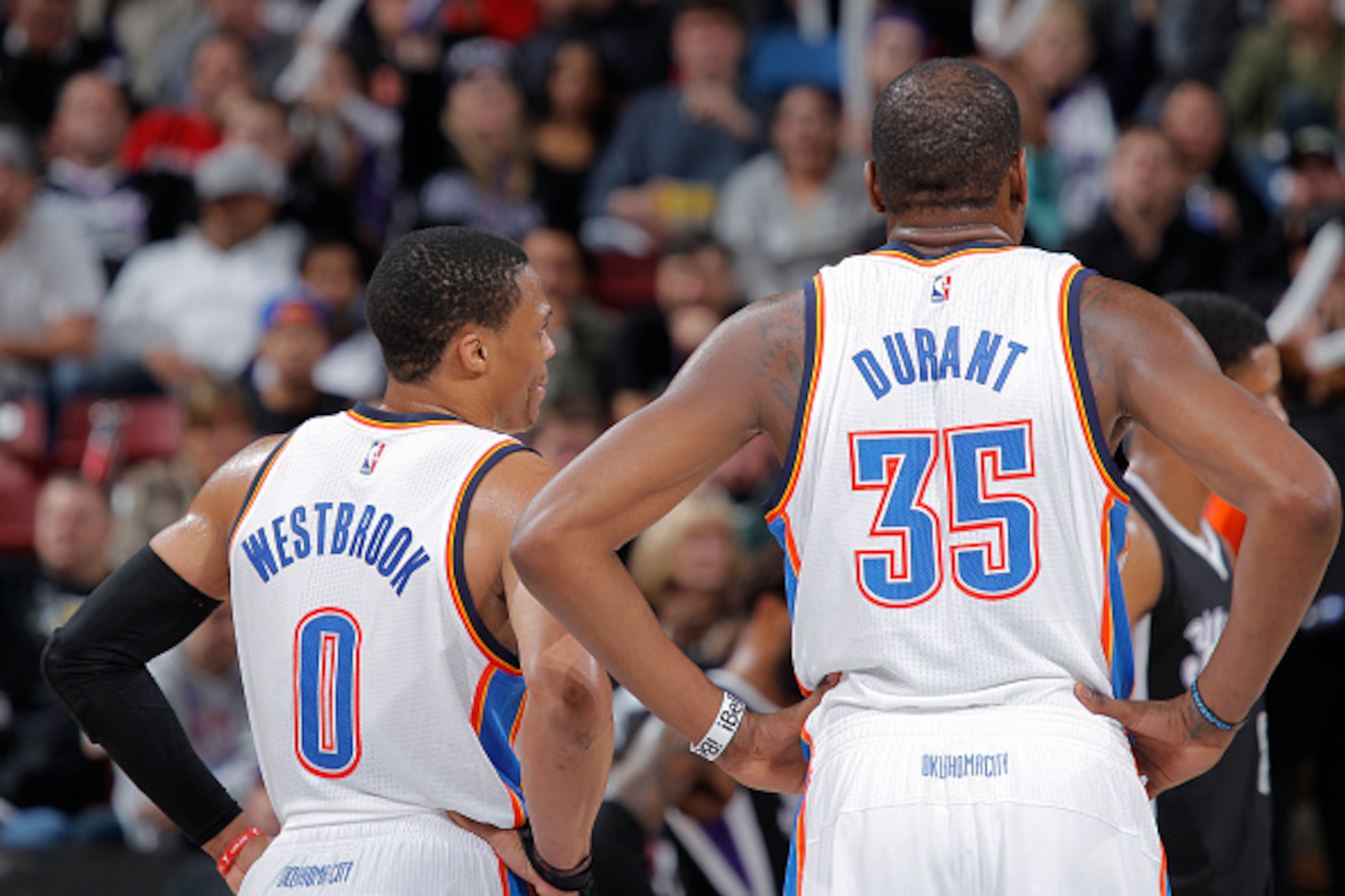 SACRAMENTO, CA - DECEMBER 16: Russell Westbrook #0 and Kevin Durant #35 of the Oklahoma City Thunder look on during the game against the Sacramento Kings on December 16, 2014 at Sleep Train Arena in Sacramento, California. NOTE TO USER: User expressly ack