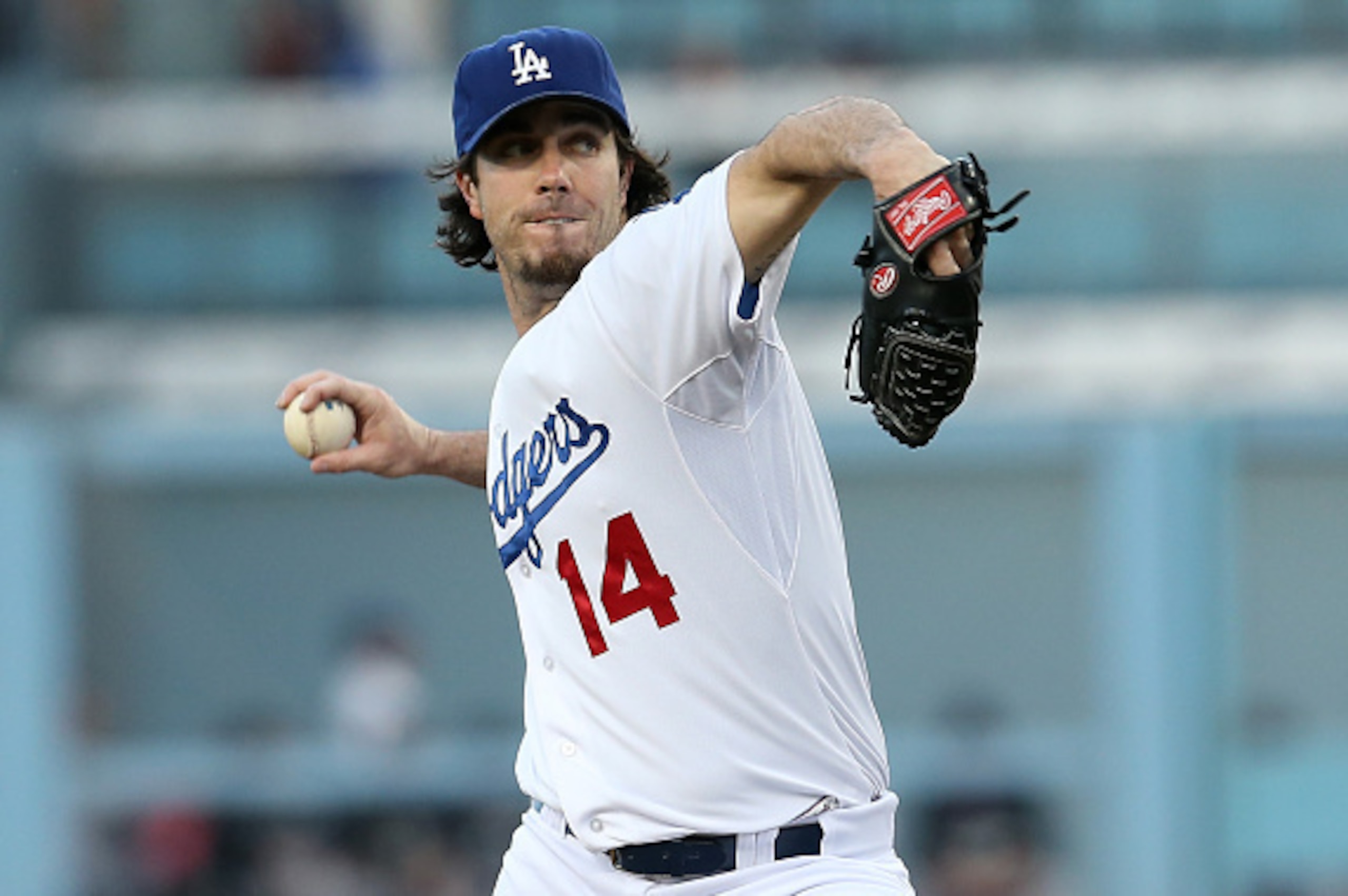 LOS ANGELES, CA - SEPTEMBER 27:  Dan Haren #14 of the Los Angeles Dodgers throws a pitch against the Colorado Rockies at Dodger Stadium on September 27, 2014 in Los Angeles, California.  (Photo by Stephen Dunn/Getty Images)