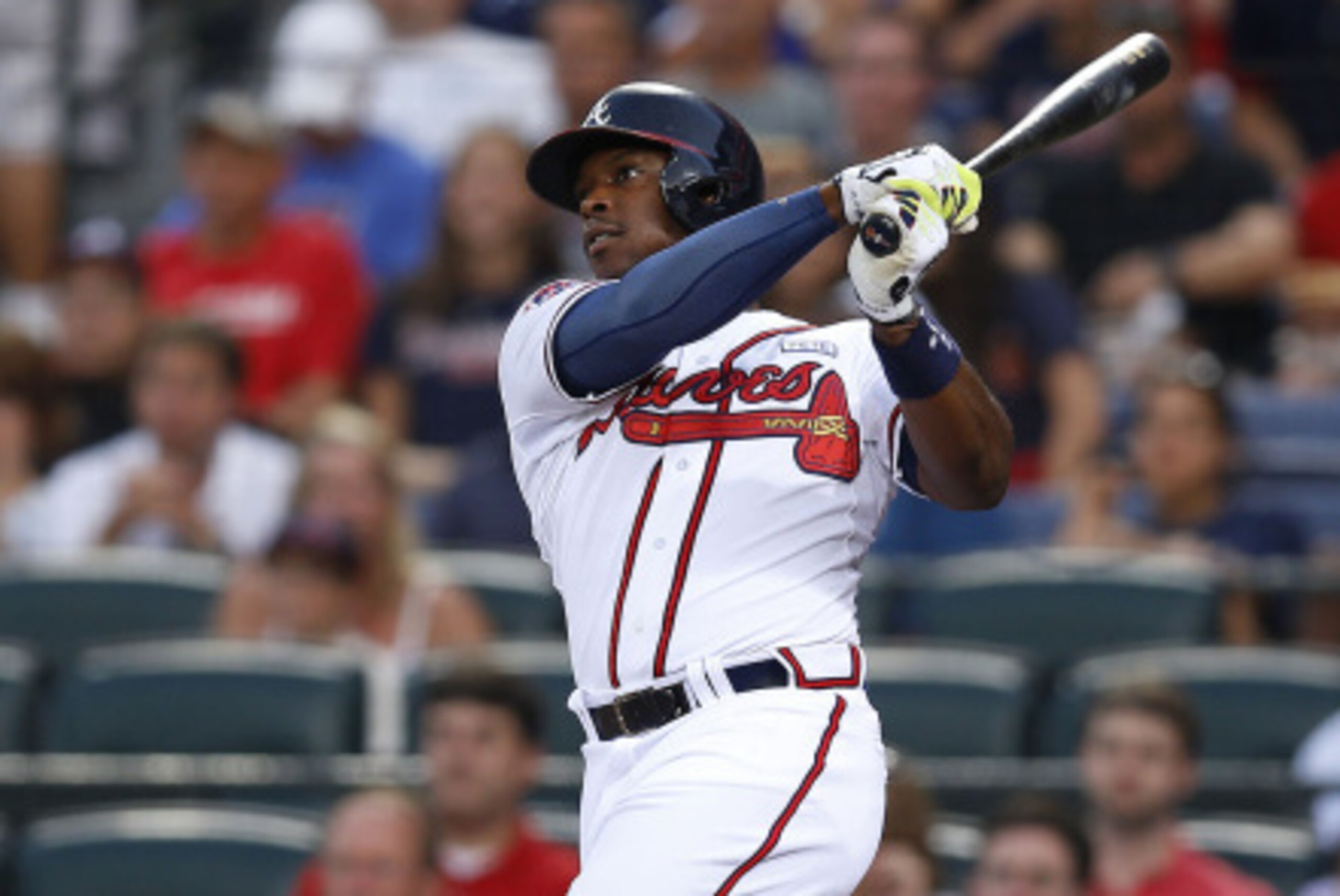 ATLANTA, GA - AUGUST 15:  Left fielder Justin Upton #8 of the Atlanta Braves hits a solo home run in the second inning of the game against the Oakland Athletics at Turner Field on August 15, 2014 in Atlanta, Georgia.  (Photo by Mike Zarrilli/Getty Images)