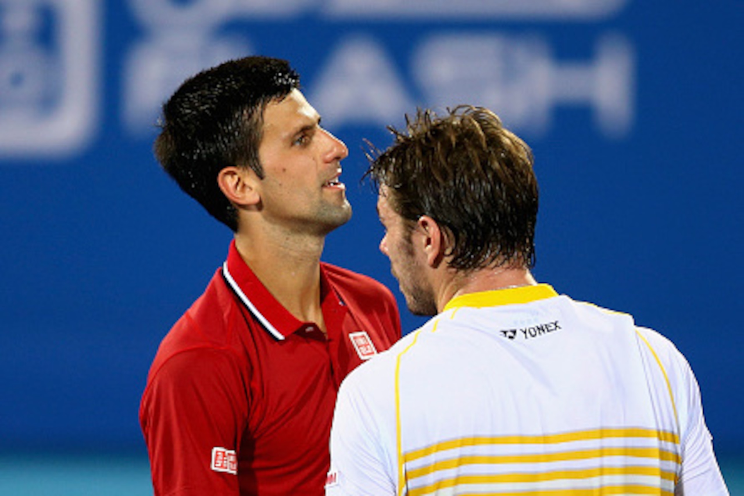 ABU DHABI, UNITED ARAB EMIRATES - JANUARY 02:  Novak Djokovic of Serbia is congratulated by  Stanislas Wawrinka of Switzerland after winning their semi final match during the Mubadala World Tennis Championship at Zayed Sport City  on January 2, 2015 in Ab