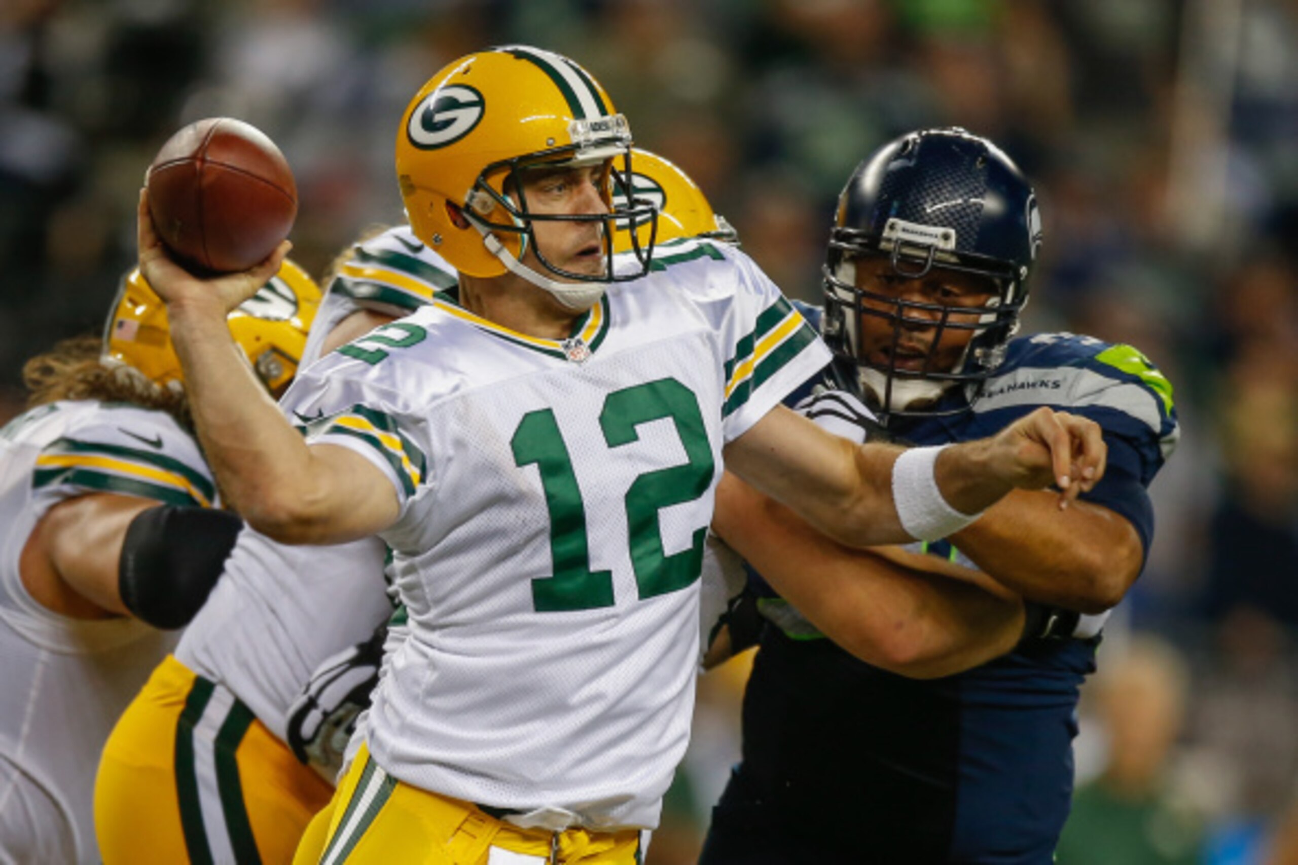 SEATTLE, WA - SEPTEMBER 04:  Quarterback Aaron Rodgers #12 of the Green Bay Packers passes against the Seattle Seahawks in the fourth quarter at CenturyLink Field on September 4, 2014 in Seattle, Washington. The Seahawks defeated the Packers 36-16. (Photo