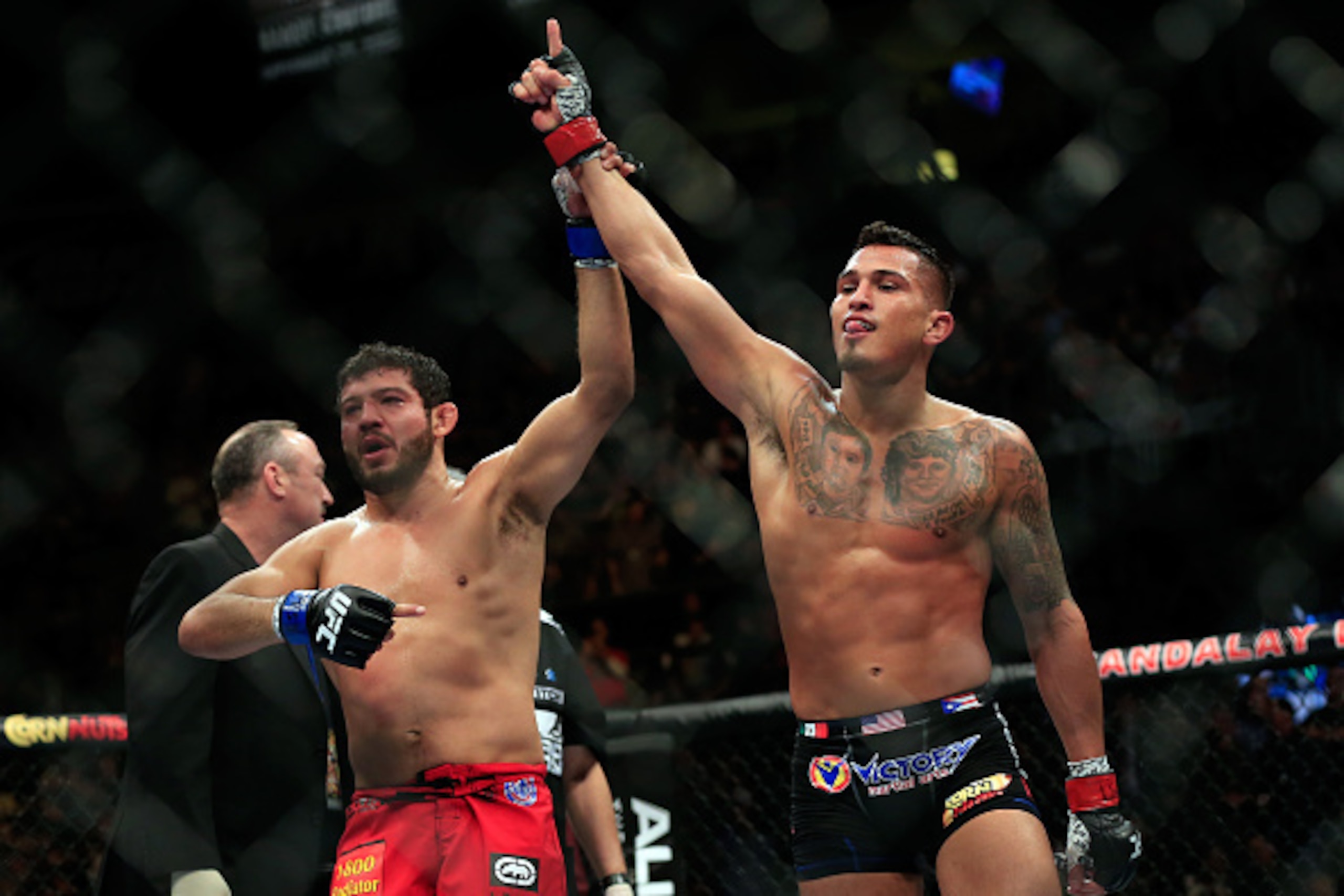 LAS VEGAS, NV - DECEMBER 06:  Anthony Pettis reacts after defeating Gilbert Menendez in their lightweight title fight during the UFC 181 event at the Mandalay Bay Events Center on December 6, 2014 in Las Vegas, Nevada.  (Photo by Alex Trautwig/Getty Image