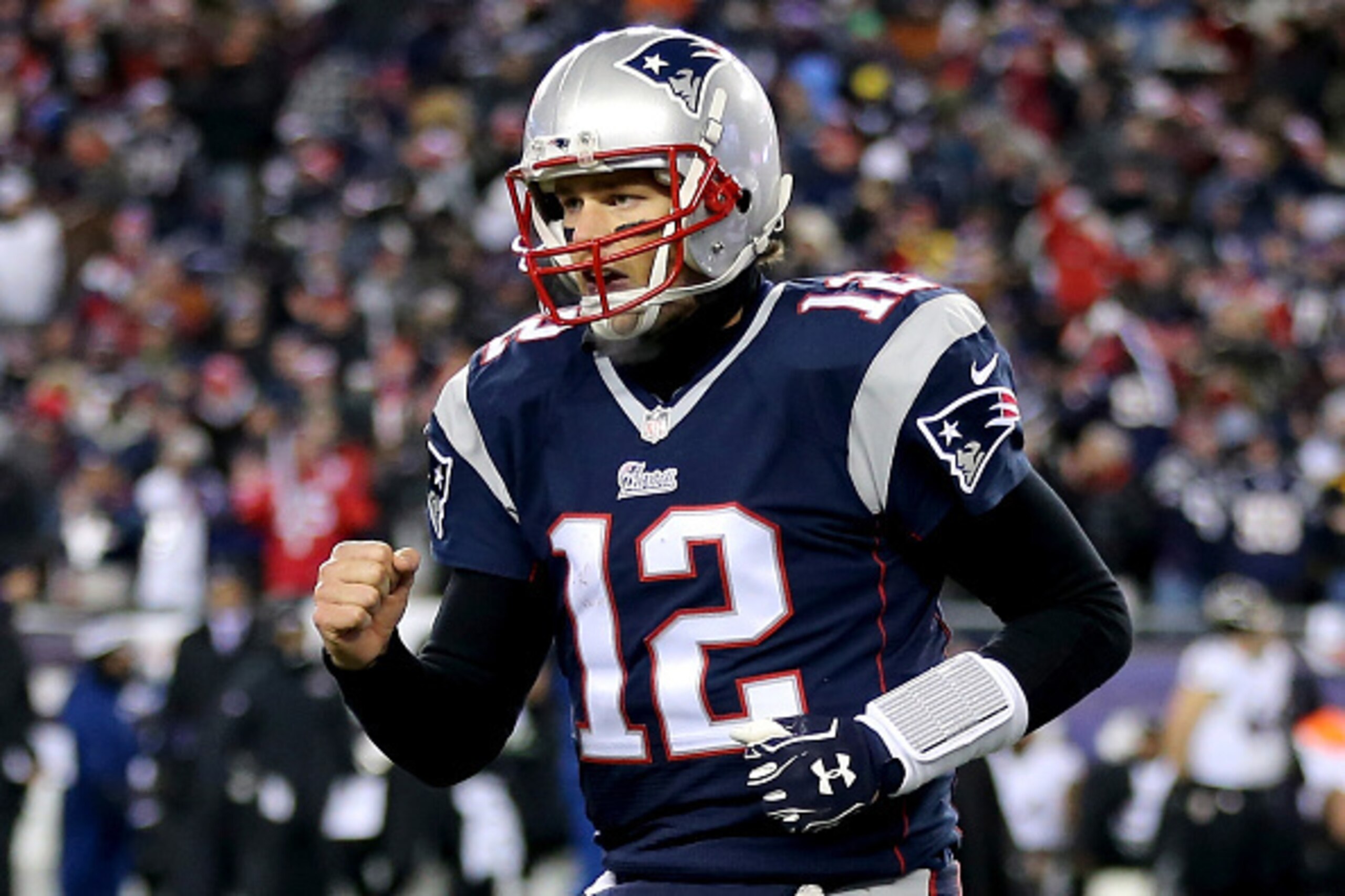 FOXBORO, MA - JANUARY 10:   Tom Brady #12 of the New England Patriots reacts after throwing a touchdown pass during the fourth quarter of the 2015 AFC Divisional Playoffs game against the Baltimore Ravens at Gillette Stadium on January 10, 2015 in Foxboro