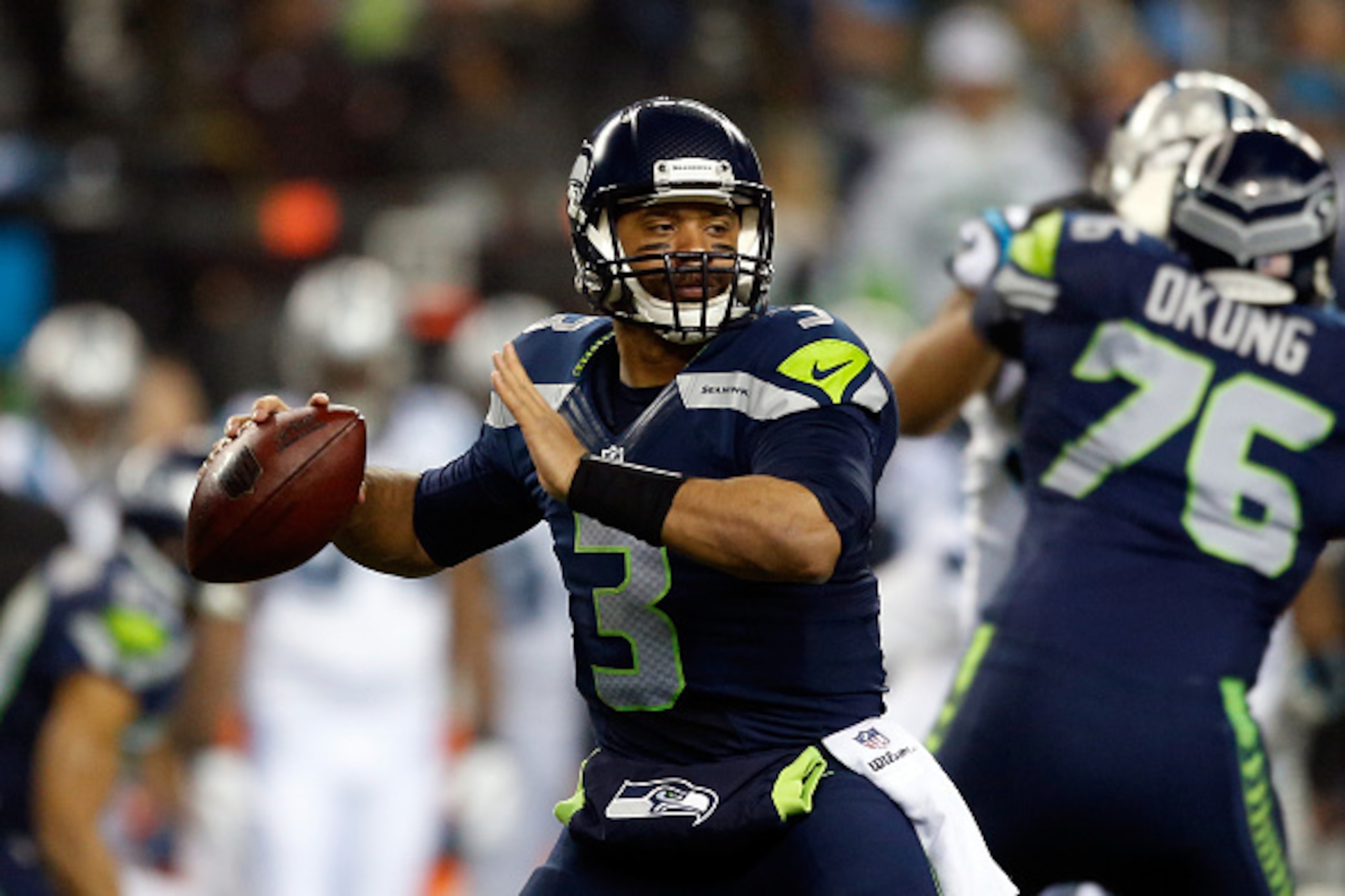 SEATTLE, WA - JANUARY 10:  Russell Wilson #3 of the Seattle Seahawks throws the ball in the first half against the Carolina Panthers during the 2015 NFC Divisional Playoff game at CenturyLink Field on January 10, 2015 in Seattle, Washington.  (Photo by Ot