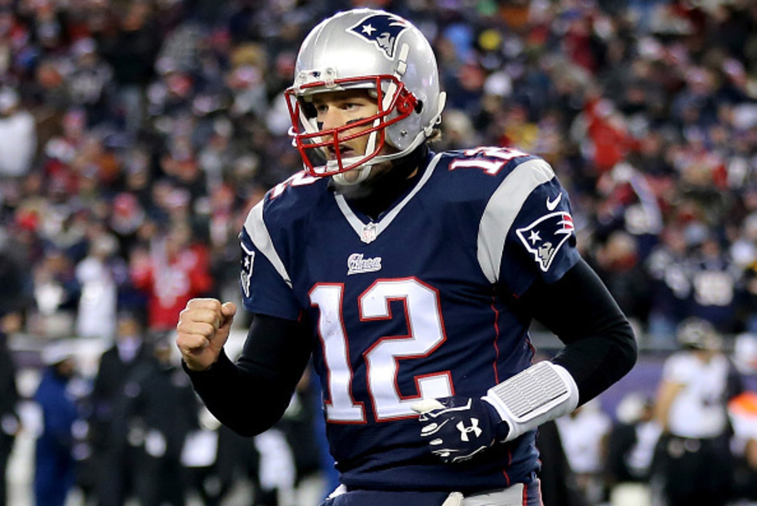 FOXBORO, MA - JANUARY 10:   Tom Brady #12 of the New England Patriots reacts after throwing a touchdown pass during the fourth quarter of the 2015 AFC Divisional Playoffs game against the Baltimore Ravens at Gillette Stadium on January 10, 2015 in Foxboro