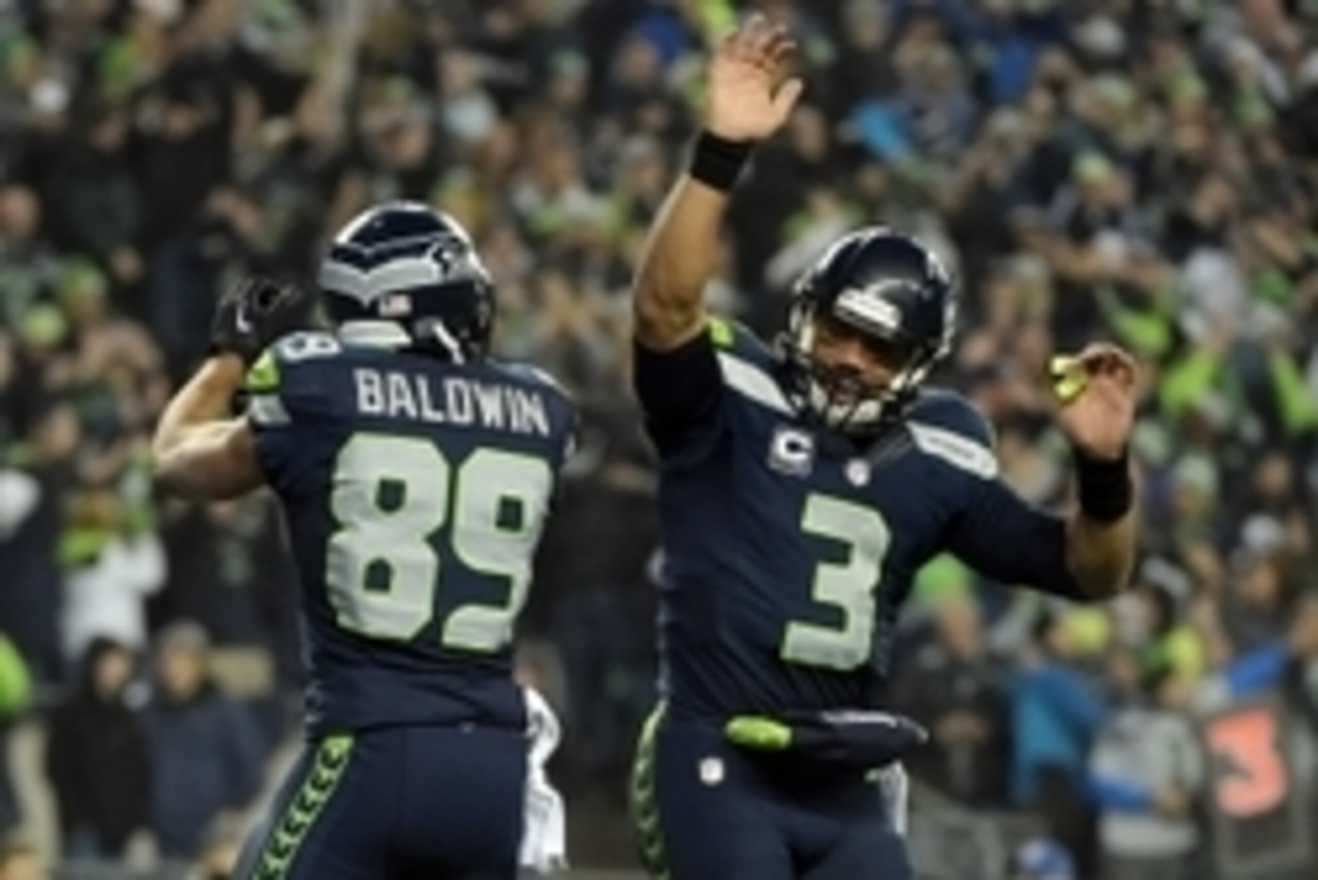 January 10, 2015; Seattle, WA, USA; Seattle Seahawks wide receiver Doug Baldwin (89) celebrates with quarterback Russell Wilson (3) after catching a touchdown pass against the Carolina Panthers during the first half in the 2014 NFC Divisional playoff foot