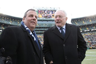 GREEN BAY, WI - JANUARY 11:  New Jersey Governor Chris Christie and Dallas Cowboys owner Jerry Jones talk prior to the 2015 NFC Divisional Playoff game between the Dallas Cowboys and the Green Bay Packers at Lambeau Field on January 11, 2015 in Green Bay,