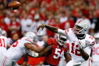 NEW ORLEANS, LA - JANUARY 01:  Cardale Jones #12 of the Ohio State Buckeyes in action against the Alabama Crimson Tide during the All State Sugar Bowl at the Mercedes-Benz Superdome on January 1, 2015 in New Orleans, Louisiana.  (Photo by Kevin C. Cox/Get