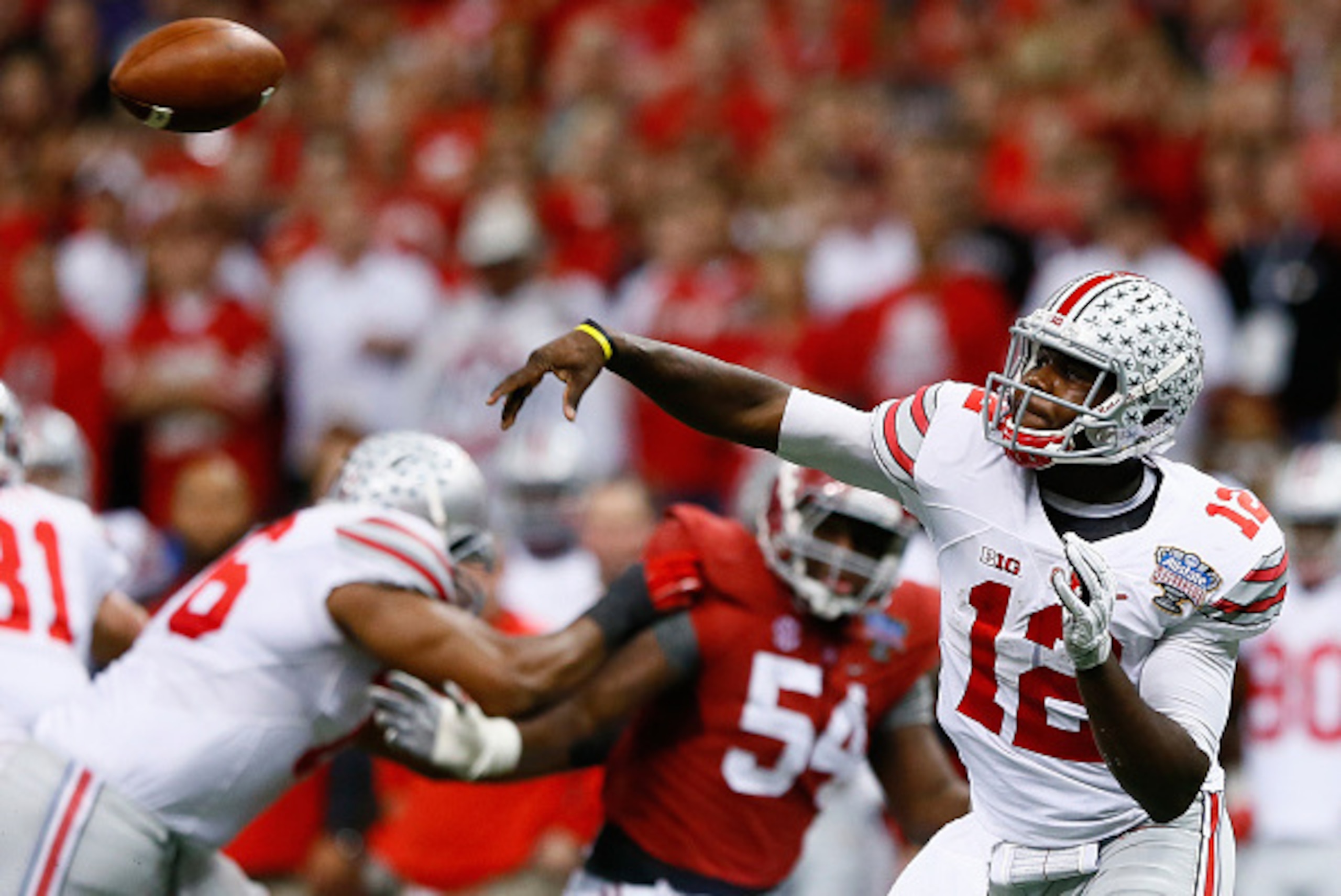 NEW ORLEANS, LA - JANUARY 01: Cardale Jones #12 of the Ohio State Buckeyes in action against the Alabama Crimson Tide during the All State Sugar Bowl at the Mercedes-Benz Superdome on January 1, 2015 in New Orleans, Louisiana. (Photo by Kevin C. Cox/Get NEW ORLEANS, LA - JANUARY 01: Cardale Jones #12 of the Ohio State Buckeyes in action against the Alabama Crimson Tide during the All State Sugar Bowl at the Mercedes-Benz Superdome on January 1, 2015 in New Orleans, Louisiana. (Photo by Kevin C. Cox/Get