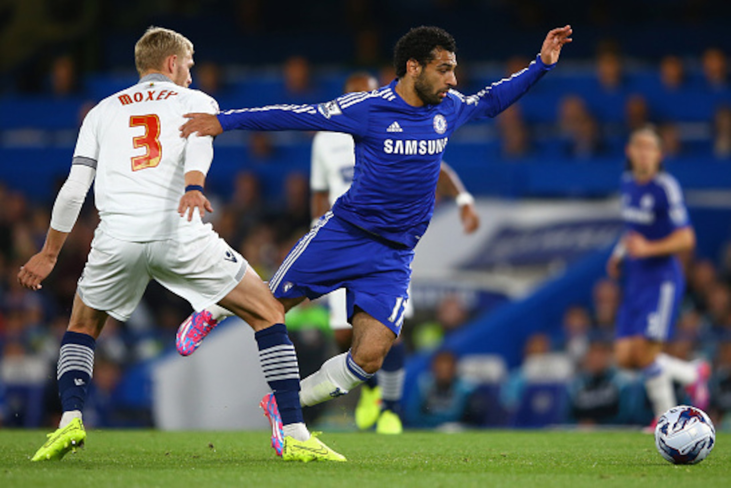 LONDON, ENGLAND - SEPTEMBER 24:  Mohamed Salah of Chelsea is tackled by Dean Moxey of Bolton during the Captial One Cup Third Round match between Chelsea and Bolton Wanderers at Stamford Bridge on September 24, 2014 in London, England.  (Photo by Richard 