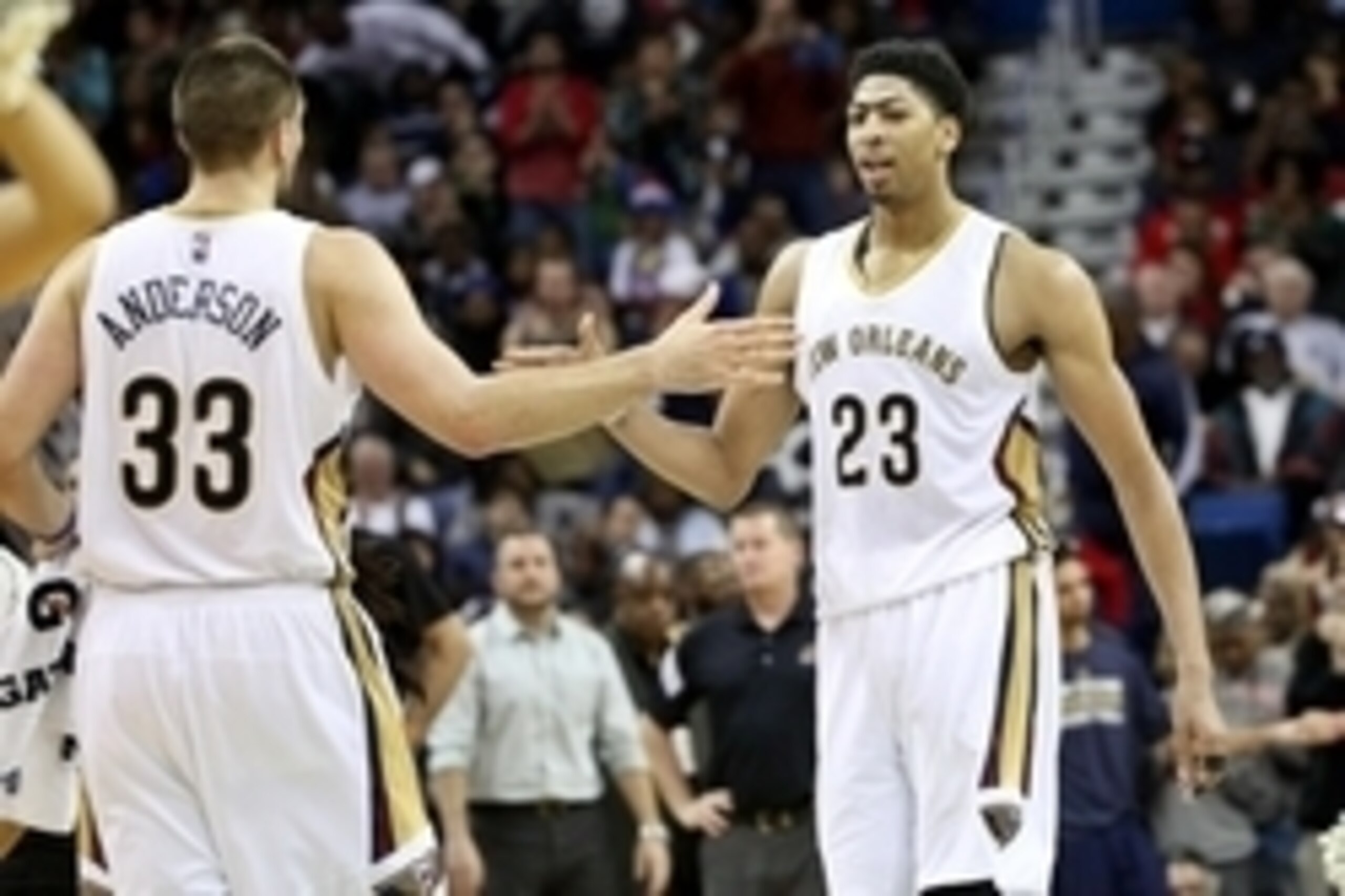 Dec 30, 2014; New Orleans, LA, USA; New Orleans Pelicans forward Anthony Davis (23) and forward Ryan Anderson (33) celebrate after a basket against the Phoenix Suns during the fourth quarter of a game at Smoothie King Center. The Pelicans defeated the Sun