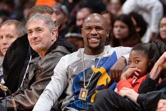 LOS ANGELES, CA - DECEMBER 28:  Boxer, Floyd Mayweather Jr. attends the Phoenix Suns game against the Los Angeles Lakers on December 28, 2014 at Staples Center in Los Angeles, California. NOTE TO USER: User expressly acknowledges and agrees that, by downl