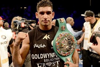 LAS VEGAS, NV-  DECEMBER 13:  Amir Khan celebrates his 12-round unanimous decision over Devon Alexander during their welterweight bout at the MGM Grand Garden Arena on December 13, 2014 in Las Vegas, Nevada. (Photo by Donald Miralle/Getty Images)