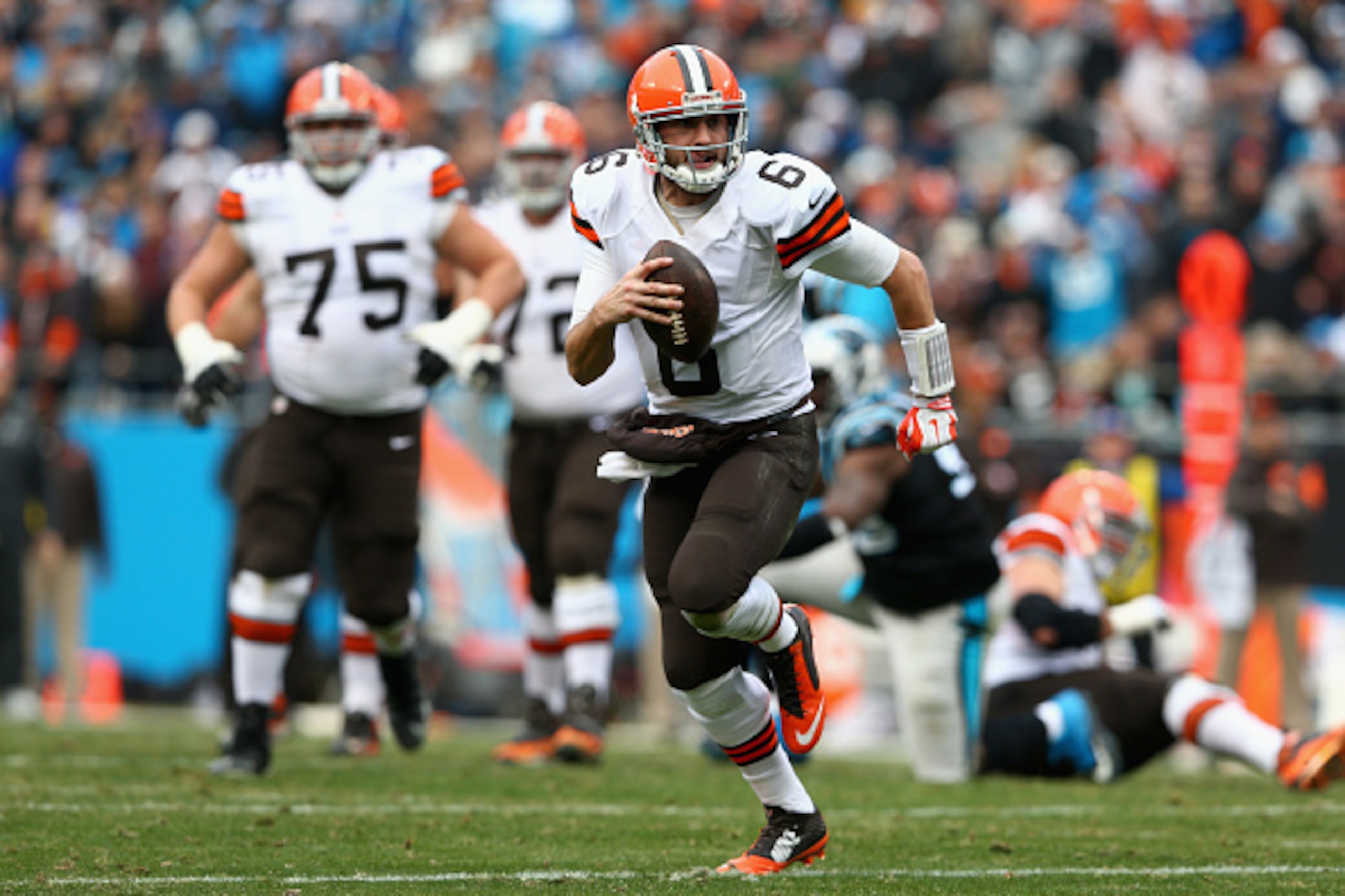 CHARLOTTE, NC - DECEMBER 21:  Brian Hoyer #6 of the Cleveland Browns scrambles for a first down against the Carolina Panthers in the 3rd quarter during their game at Bank of America Stadium on December 21, 2014 in Charlotte, North Carolina.  (Photo by Str