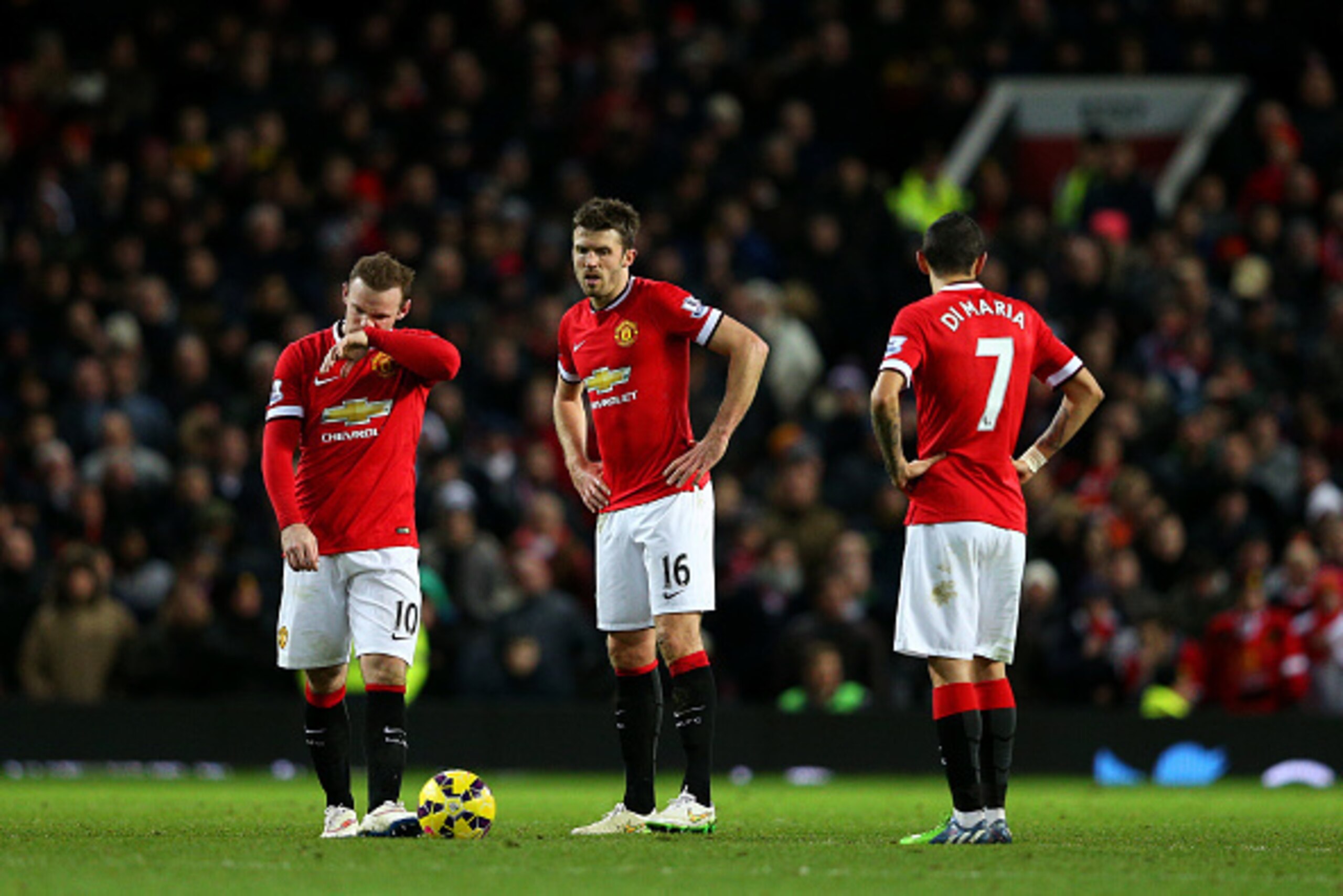 MANCHESTER, ENGLAND - JANUARY 11: Wayne Rooney, Michael Carrick and Angel di Maria of Manchester United show their dejection after conceding a goal during the Barclays Premier League match between Manchester United and Southampton at Old Trafford on Janu MANCHESTER, ENGLAND - JANUARY 11: Wayne Rooney, Michael Carrick and Angel di Maria of Manchester United show their dejection after conceding a goal during the Barclays Premier League match between Manchester United and Southampton at Old Trafford on Janu