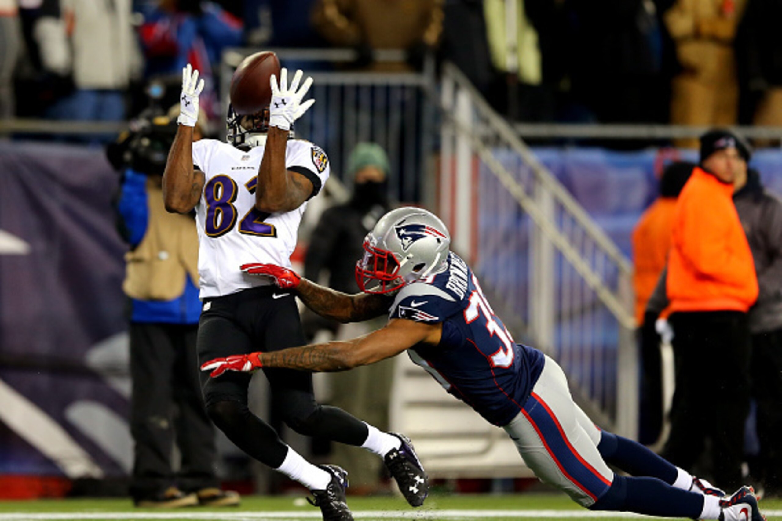 FOXBORO, MA - JANUARY 10:  Torrey Smith #82 of the Baltimore Ravens makes a catch against  LeGarrette Blount #29 of the New England Patriots in the third quarter during the 2015 AFC Divisional Playoffs game at Gillette Stadium on January 10, 2015 in Foxbo