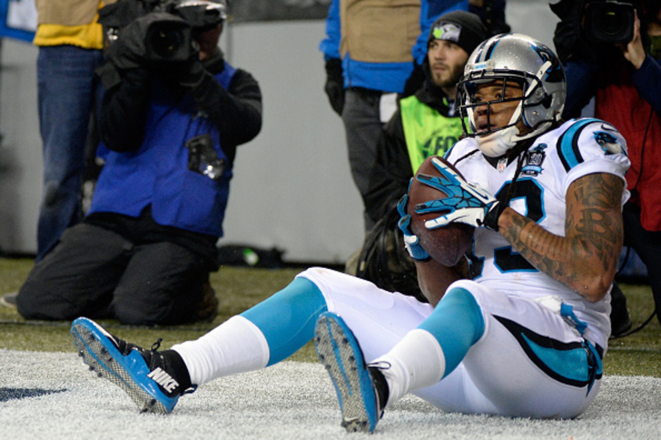 SEATTLE, WA - JANUARY 10:  Kelvin Benjamin #13 of the Carolina Panthers reacts after scoring a 15 yard touchdown thrown by Cam Newton #1 in the fourth quarter against the Seattle Seahawks during the 2015 NFC Divisional Playoff game at CenturyLink Field on