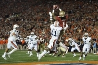 Jan 6, 2014; Pasadena, CA, USA; Florida State Seminoles wide receiver Kelvin Benjamin (1) catches a touchdown pass over Auburn Tigers cornerback Chris Davis (11) during the second half of the 2014 BCS National Championship game at the Rose Bowl.  Mandator