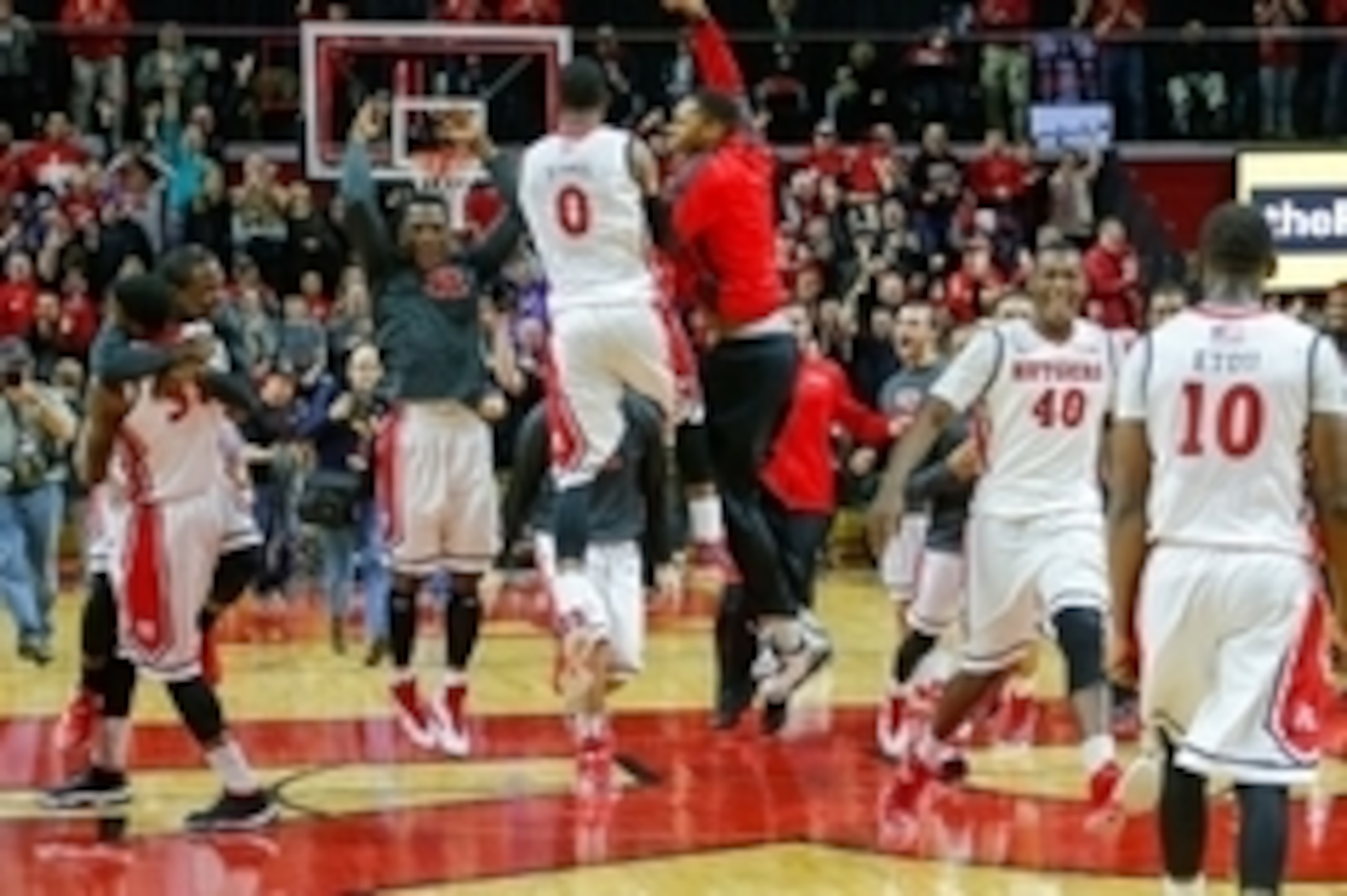 Jan 11, 2015; Piscataway, NJ, USA; Rutgers Scarlet Knights celebrate 67-62 upset victory over Wisconsin Badgers at Louis Brown Athletic Center. Mandatory Credit: Jim O'Connor-USA TODAY Sports