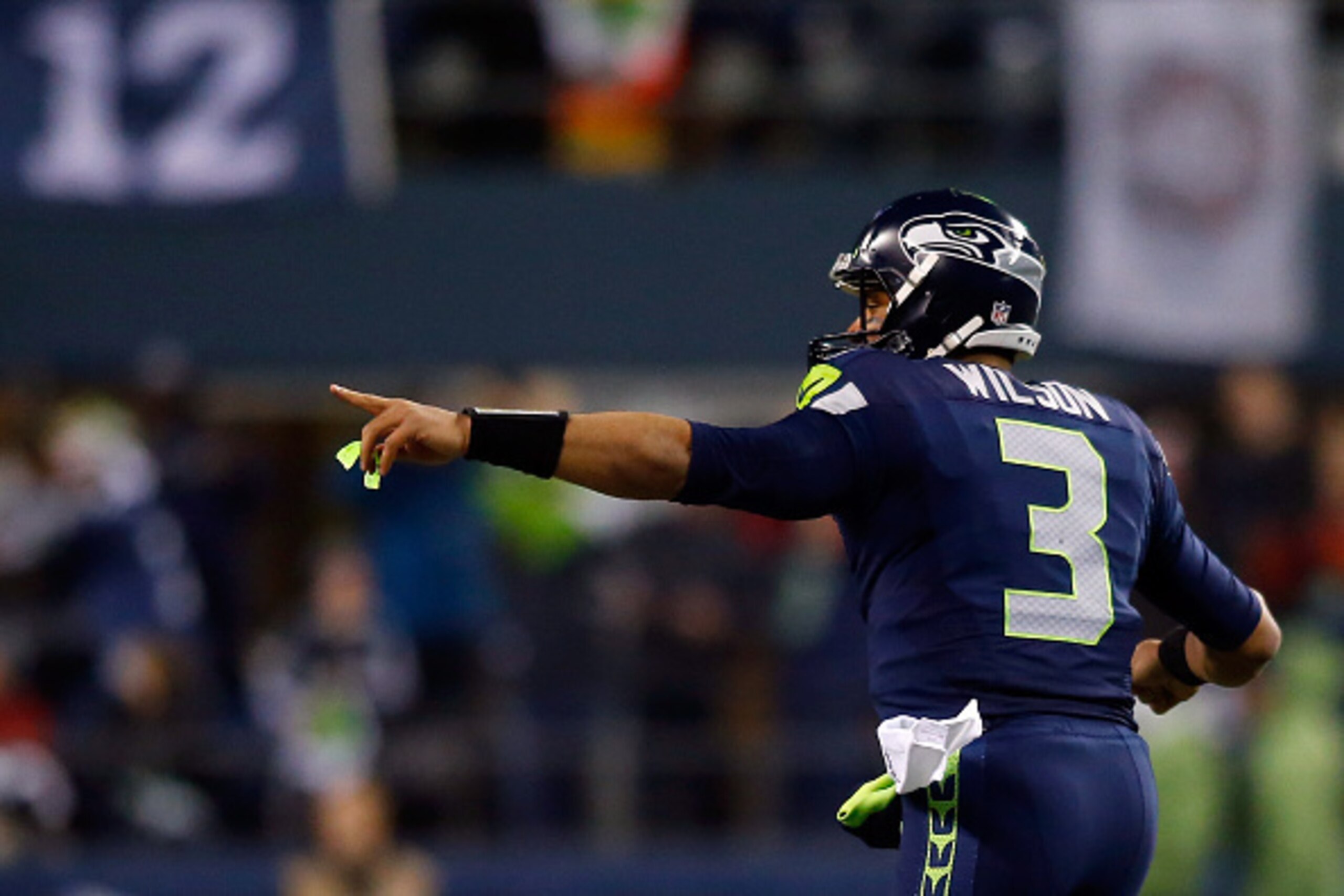 SEATTLE, WA - JANUARY 10:  Russell Wilson #3 celebrates Jermaine Kearse #15 of the Seattle Seahawks 63 yard touchdown in the second quarter against the Carolina Panthers during the 2015 NFC Divisional Playoff game at CenturyLink Field on January 10, 2015 