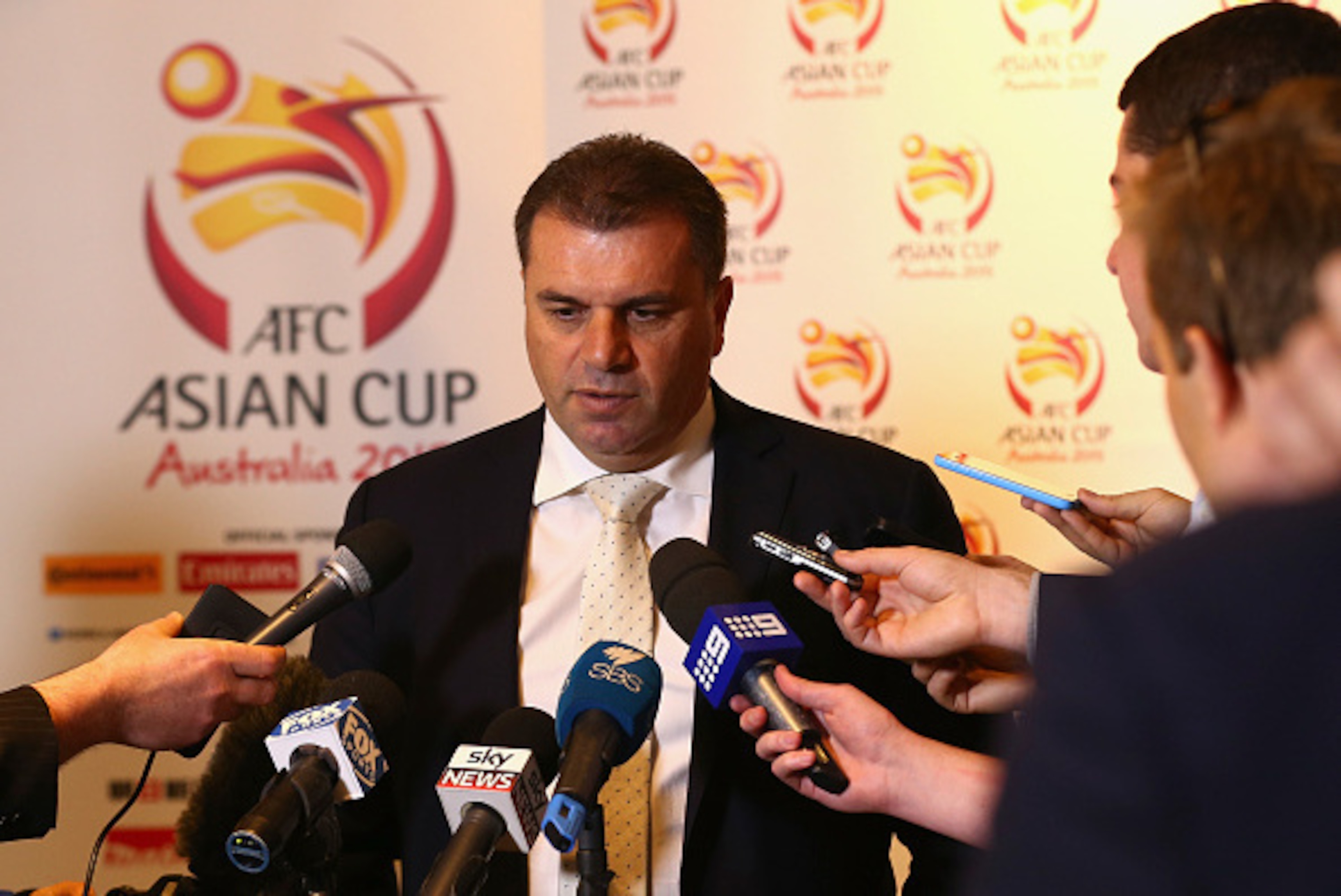 SYDNEY, AUSTRALIA - OCTOBER 01: Ange Postecoglou, Head Coach Socceroos, speaks during a media opportunity to mark the 100 day countdown until the beginning of the 2015 Asian Cup, at Hilton Hotel on October 1, 2014 in Sydney, Australia. (Photo by Ryan Pi SYDNEY, AUSTRALIA - OCTOBER 01: Ange Postecoglou, Head Coach Socceroos, speaks during a media opportunity to mark the 100 day countdown until the beginning of the 2015 Asian Cup, at Hilton Hotel on October 1, 2014 in Sydney, Australia. (Photo by Ryan Pi