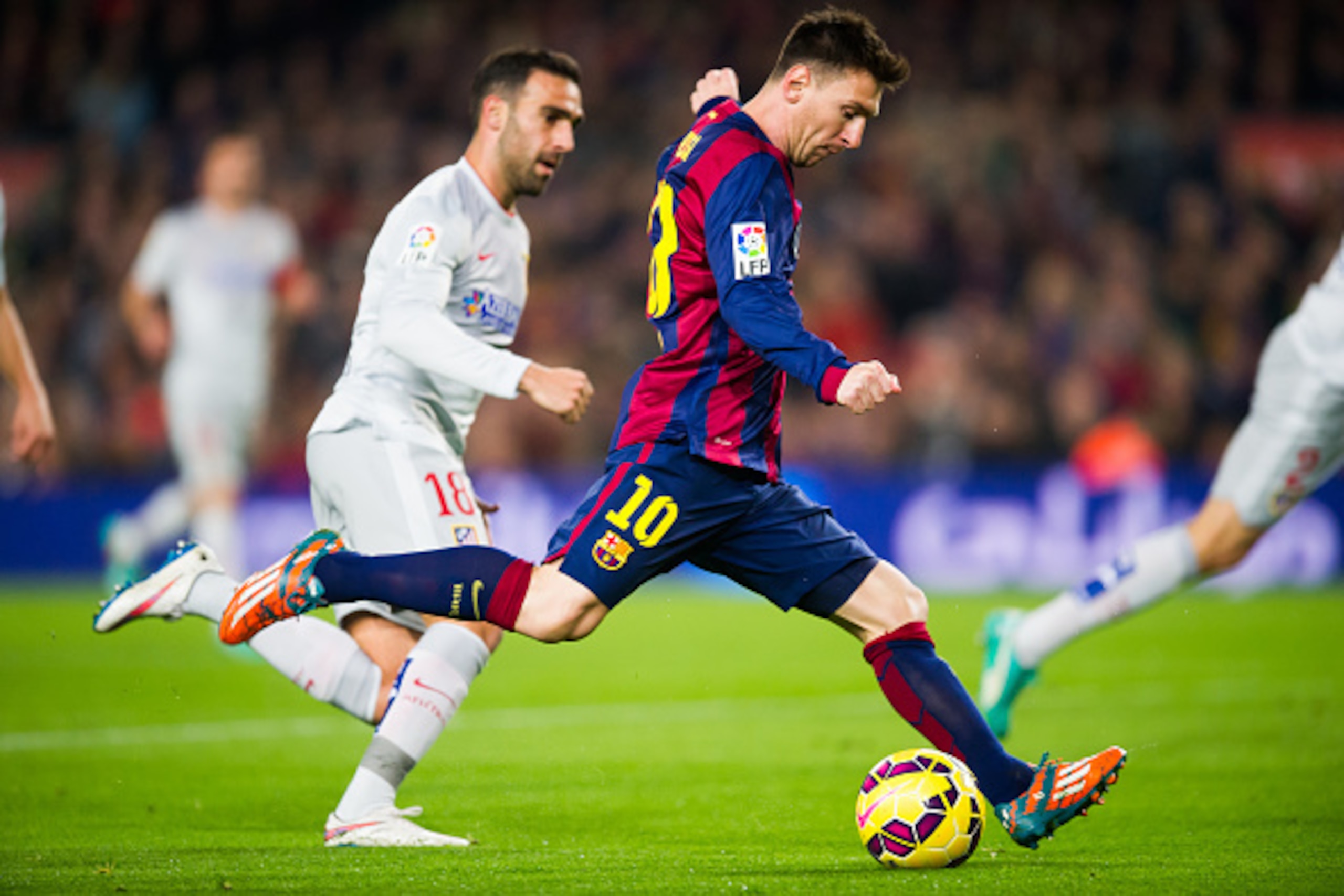 BARCELONA, SPAIN - JANUARY 11: Lionel Messi of FC Barcelona shoots during the La Liga match between FC Barcelona and Club Atletico de Madrid at Camp Nou on January 11, 2015 in Barcelona, Spain. (Photo by Alex Caparros/Getty Images)