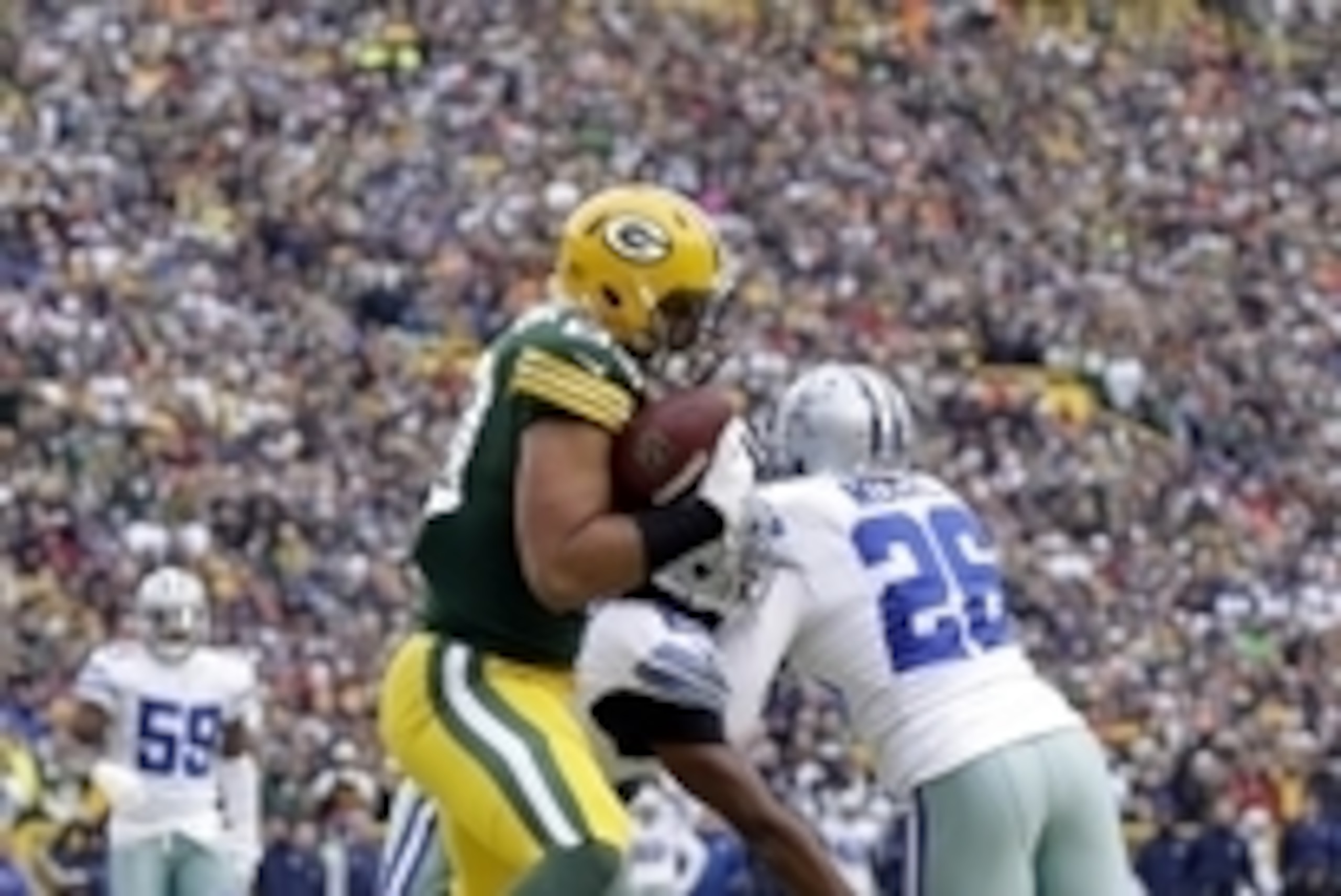 Jan 11, 2015; Green Bay, WI, USA; Green Bay Packers tight end Richard Rodgers (89) catches a pass for a touchdown against Dallas Cowboys defensive back Sterling Moore (26) and free safety J.J. Wilcox (27) in the fourth quarter in the 2014 NFC Divisional p Jan 11, 2015; Green Bay, WI, USA; Green Bay Packers tight end Richard Rodgers (89) catches a pass for a touchdown against Dallas Cowboys defensive back Sterling Moore (26) and free safety J.J. Wilcox (27) in the fourth quarter in the 2014 NFC Divisional p