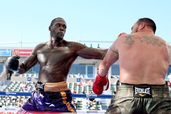 LOS ANGELES, CA - AUGUST 16:  Deontay Wilder (L) lands a punch on Jason Gavern in their heavywieght fight at StubHub Center on August 16, 2014 in Los Angeles, California.  (Photo by Stephen Dunn/Getty Images)