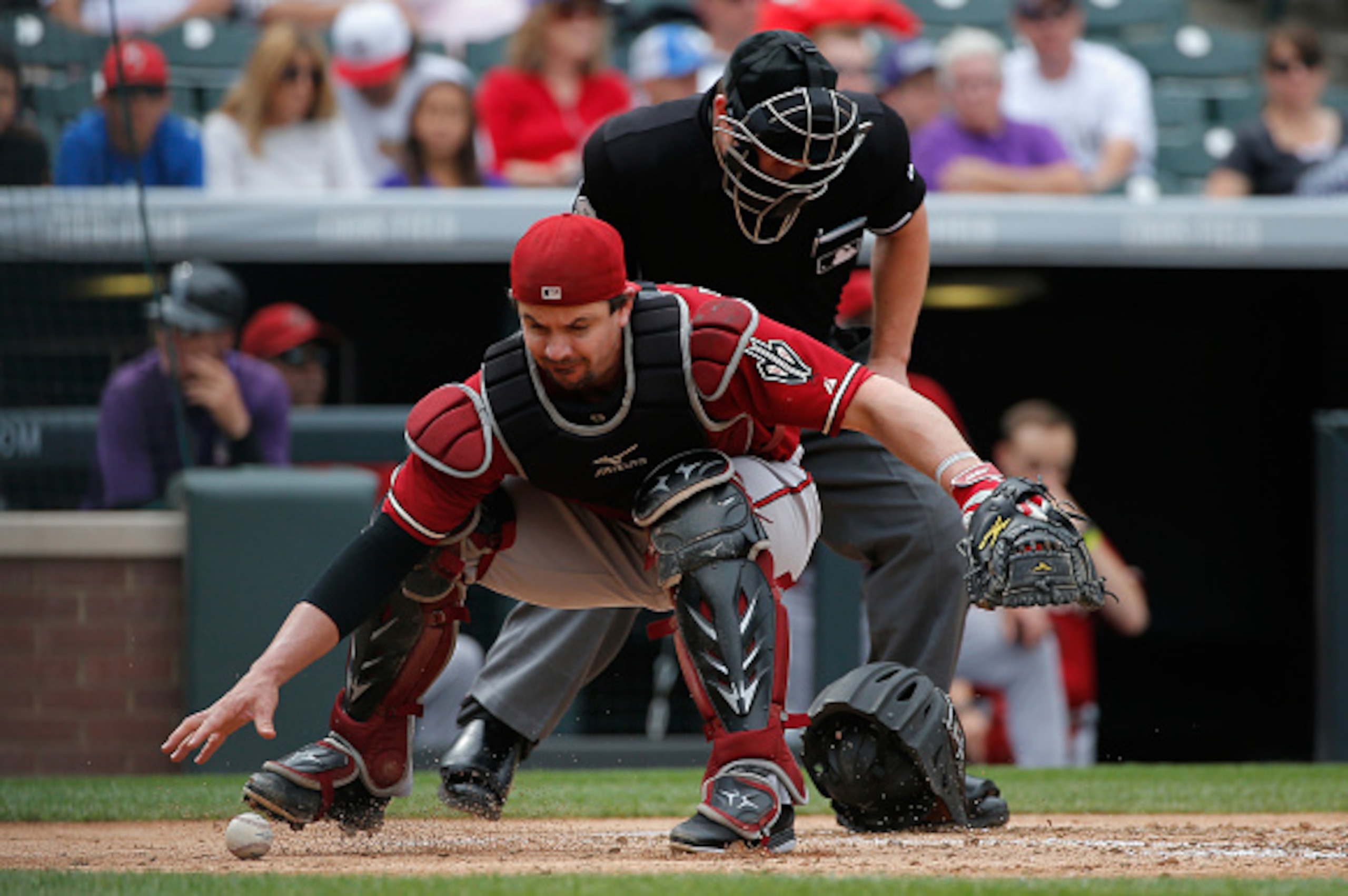 DENVER, CO - SEPTEMBER 21: Catcher Tuffy Gosewisch #9 of the Arizona Diamondbacks collects the ball against the Colorado Rockies at Coors Field on September 21, 2014 in Denver, Colorado. The Rockies defeated the Diamondbacks 8-3. (Photo by Doug Pensinge DENVER, CO - SEPTEMBER 21: Catcher Tuffy Gosewisch #9 of the Arizona Diamondbacks collects the ball against the Colorado Rockies at Coors Field on September 21, 2014 in Denver, Colorado. The Rockies defeated the Diamondbacks 8-3. (Photo by Doug Pensinge